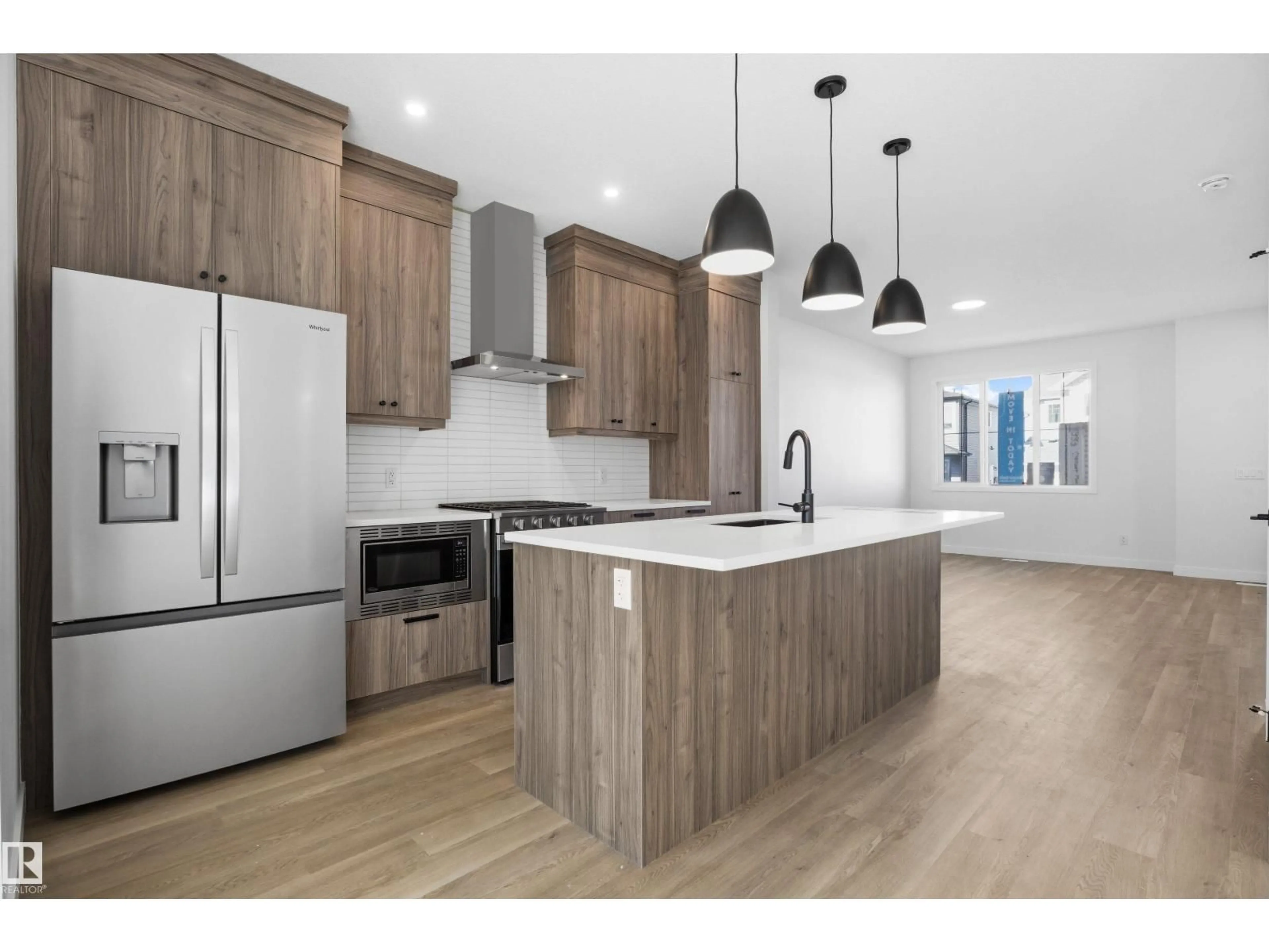 Open concept kitchen, wood/laminate floor for SW - 1227 CRISTALL WY, Edmonton Alberta T6W5T1