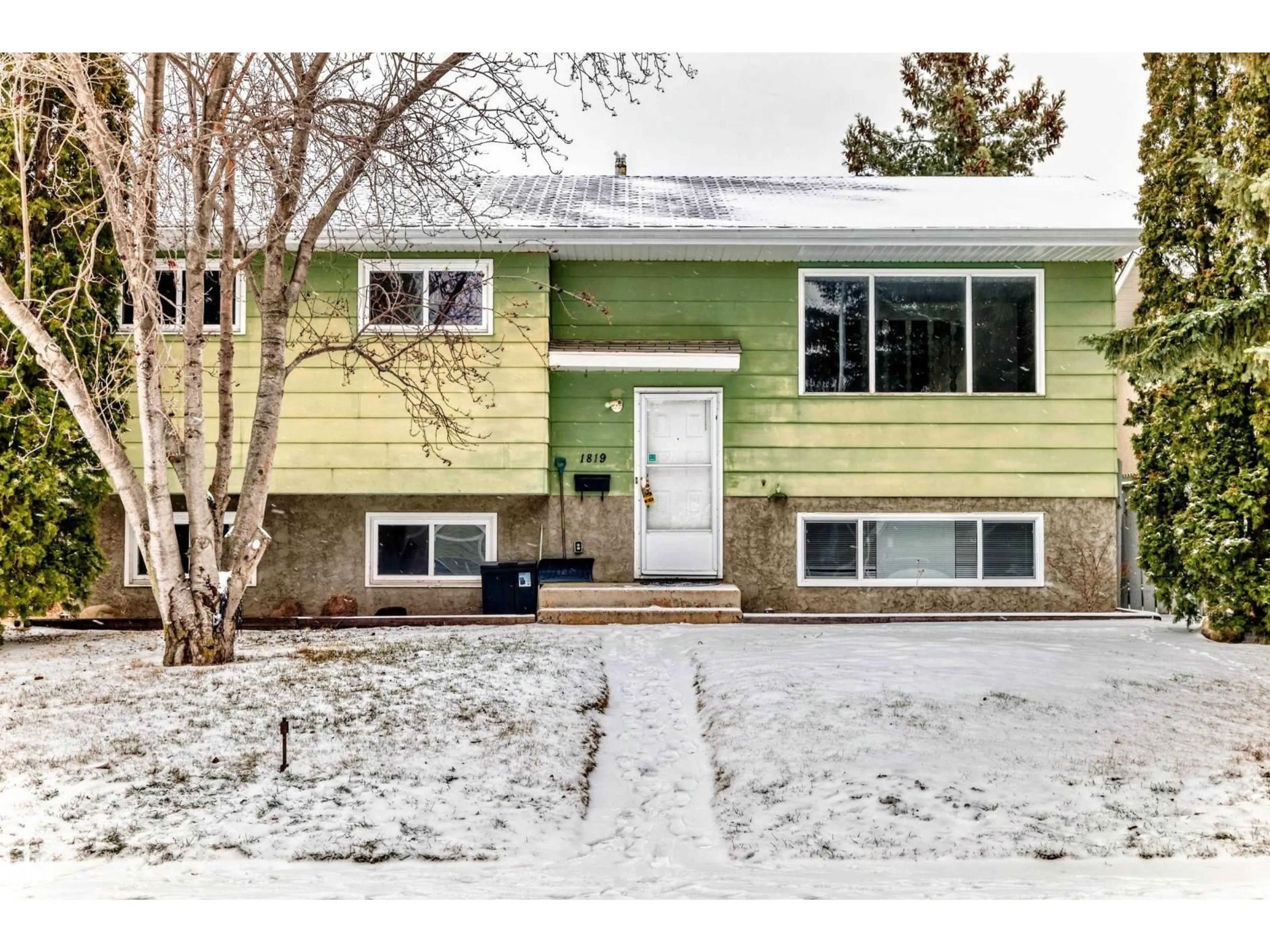 Home with vinyl exterior material, street for NW - 1819 56 ST, Edmonton Alberta T6L1L6