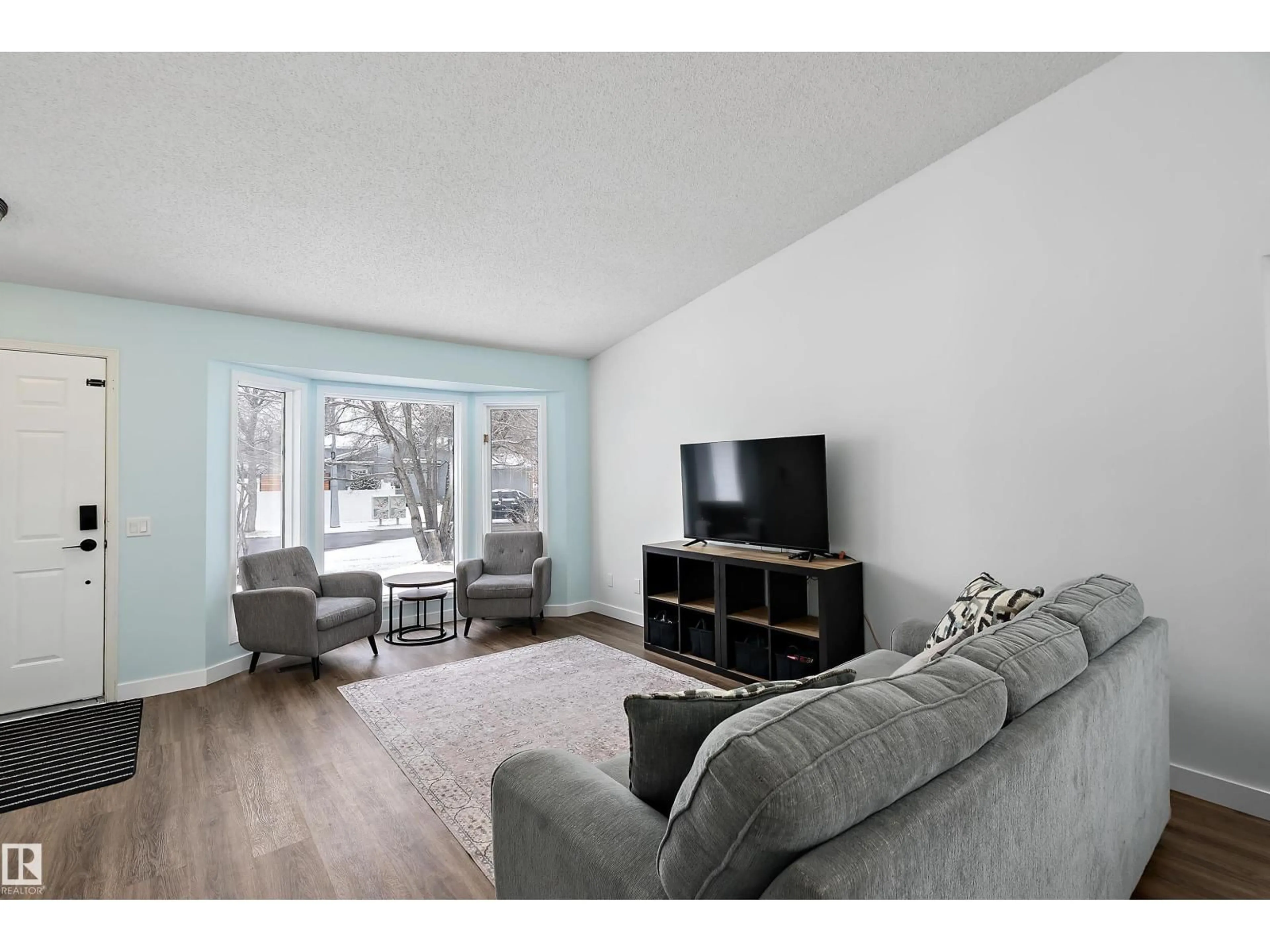 Living room with furniture, wood/laminate floor for 49 DEERBOURNE DR, St. Albert Alberta T8N4R2