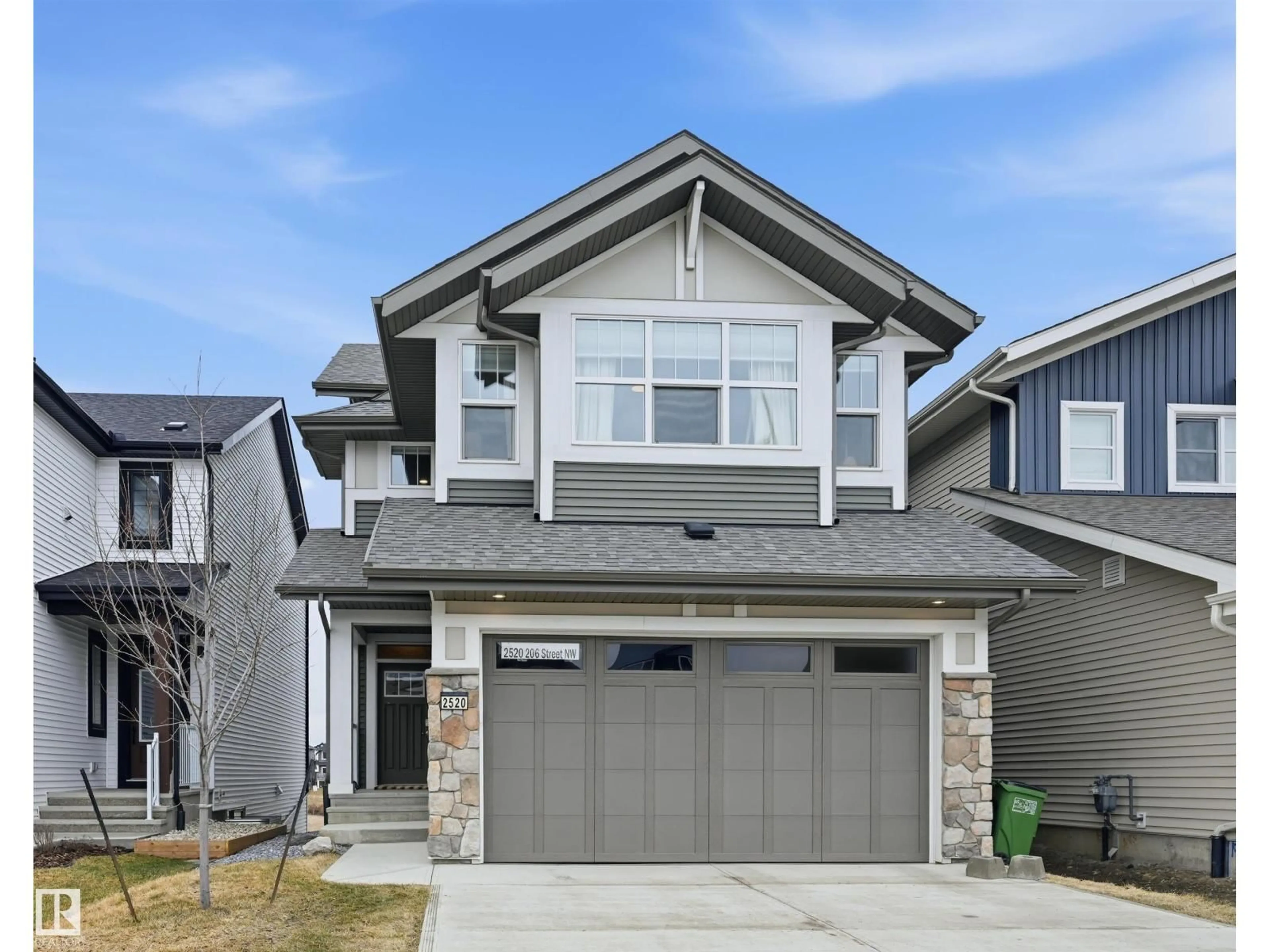 Home with vinyl exterior material, street for NW - 2520 206 ST, Edmonton Alberta T6M1P1
