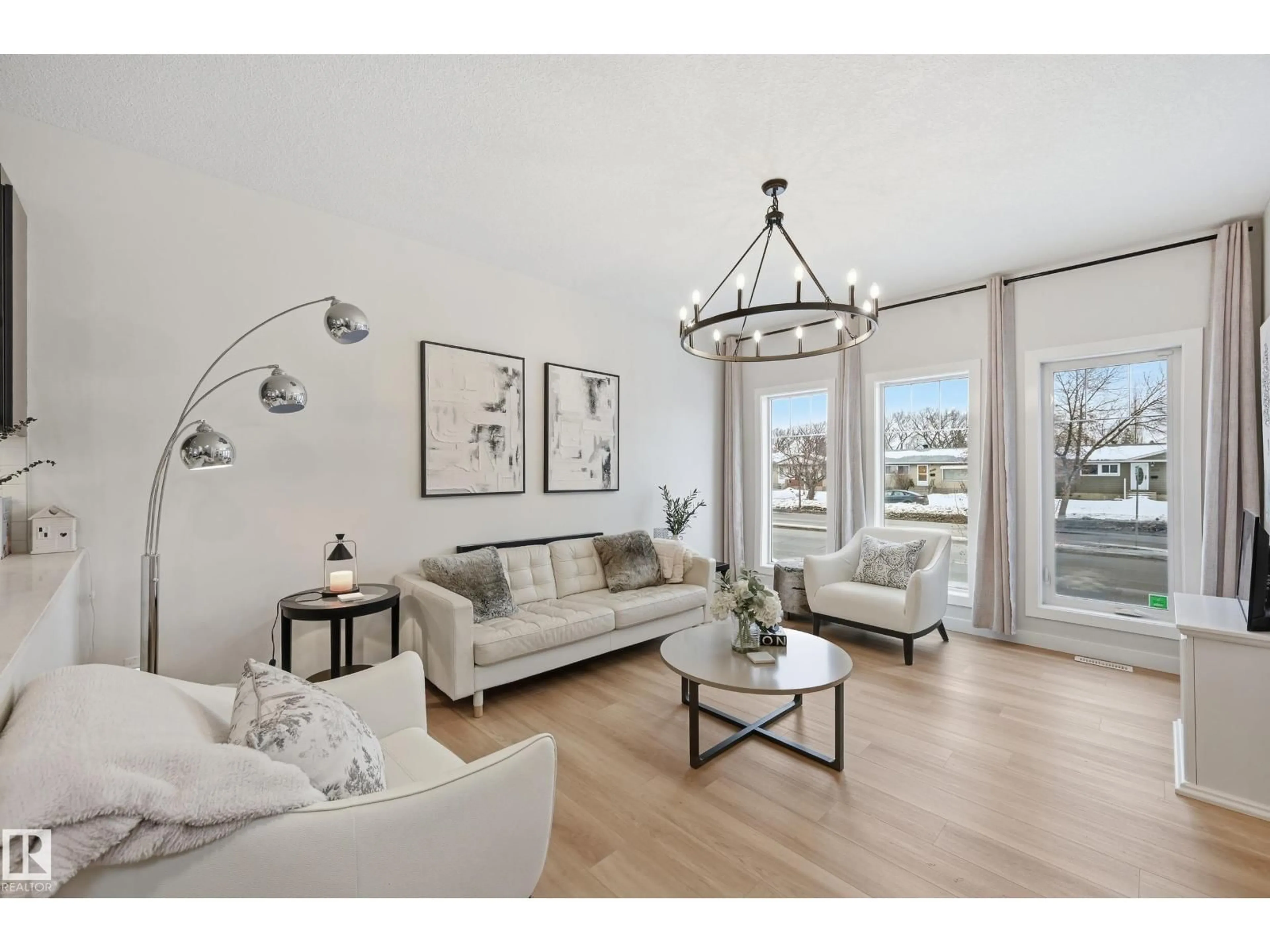Living room with furniture, wood/laminate floor for NW - 10736 149 ST, Edmonton Alberta T5P1M2