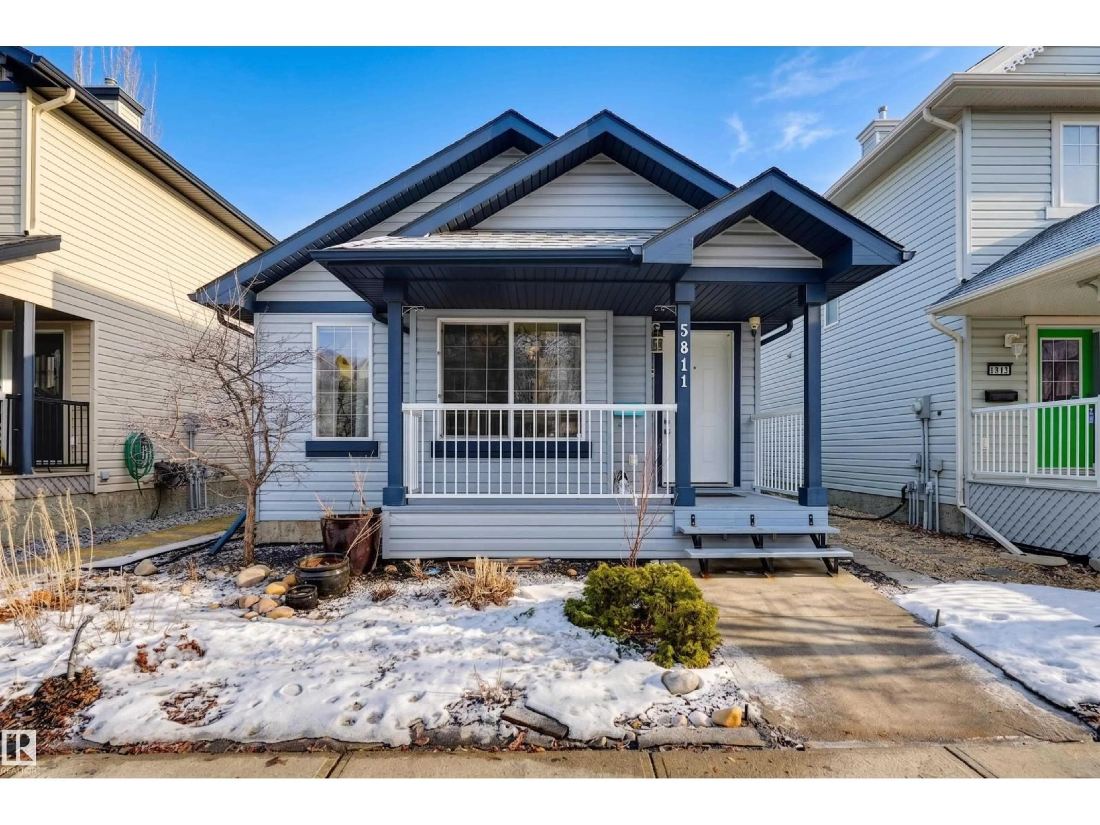 Home with vinyl exterior material, street for 5811 SUTTER PL, Edmonton Alberta T6R3R3