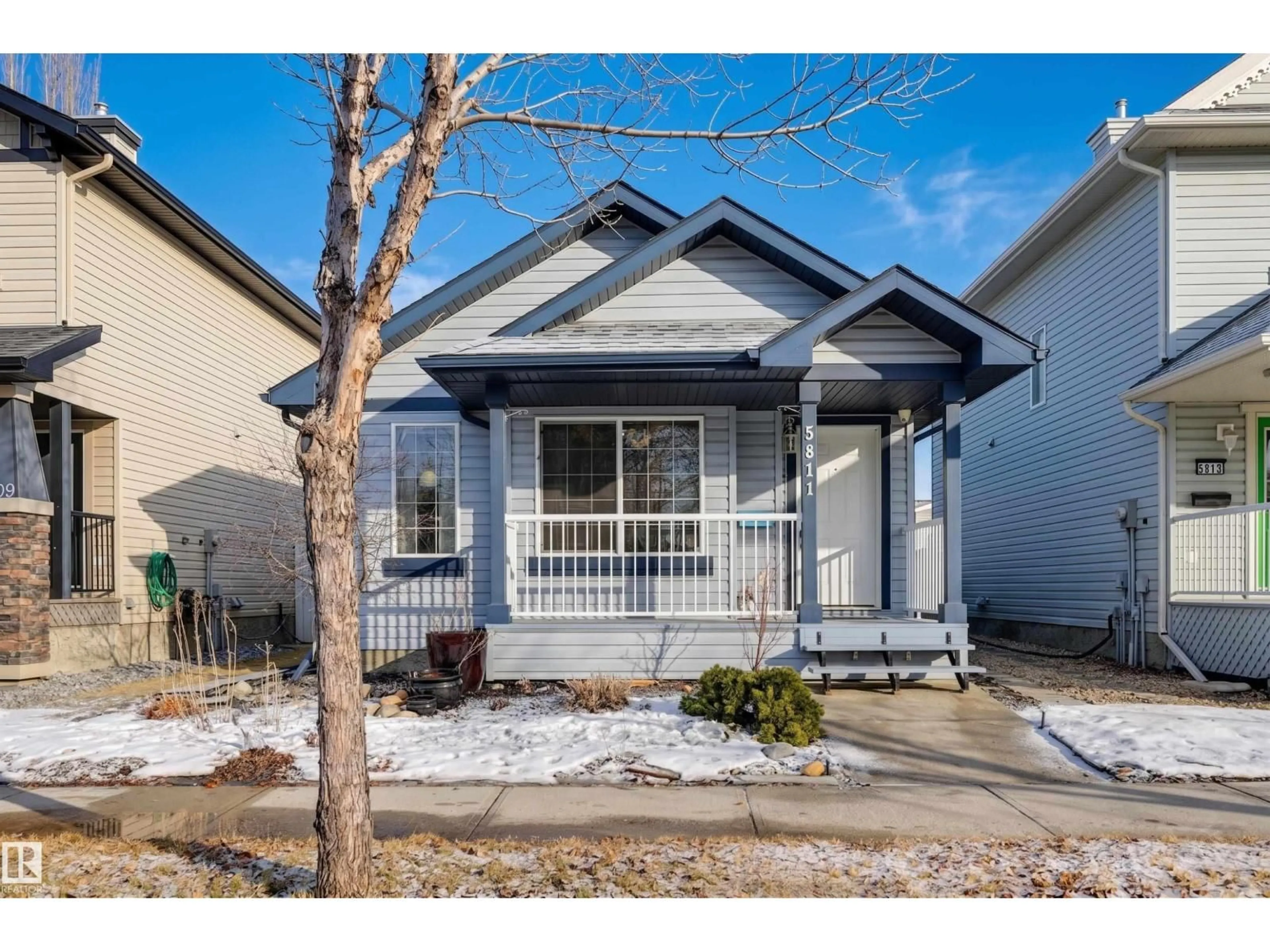 Home with vinyl exterior material, street for 5811 SUTTER PL, Edmonton Alberta T6R3R3