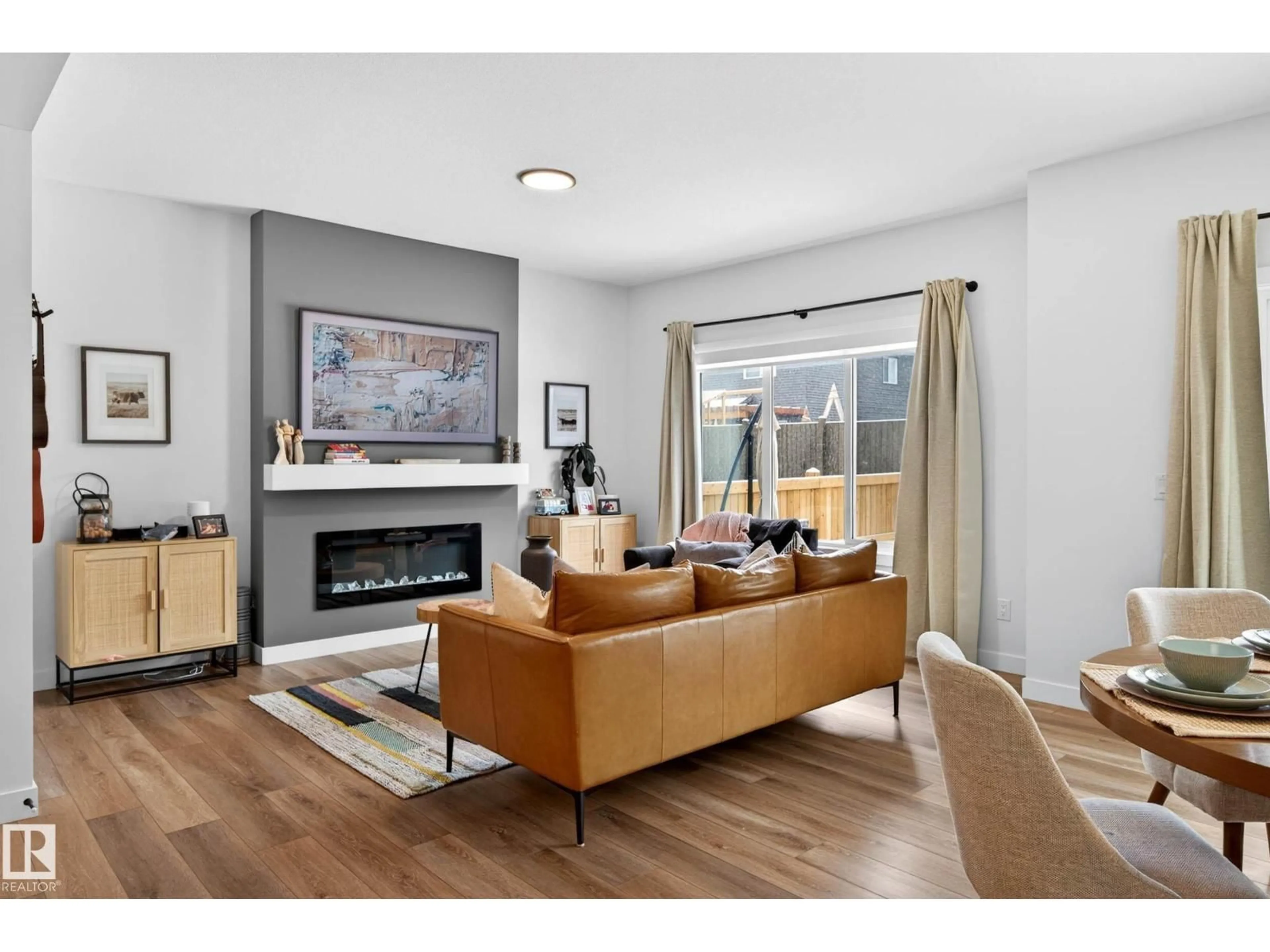 Living room with furniture, wood/laminate floor for 51 PENN PL, Spruce Grove Alberta T7X2W7