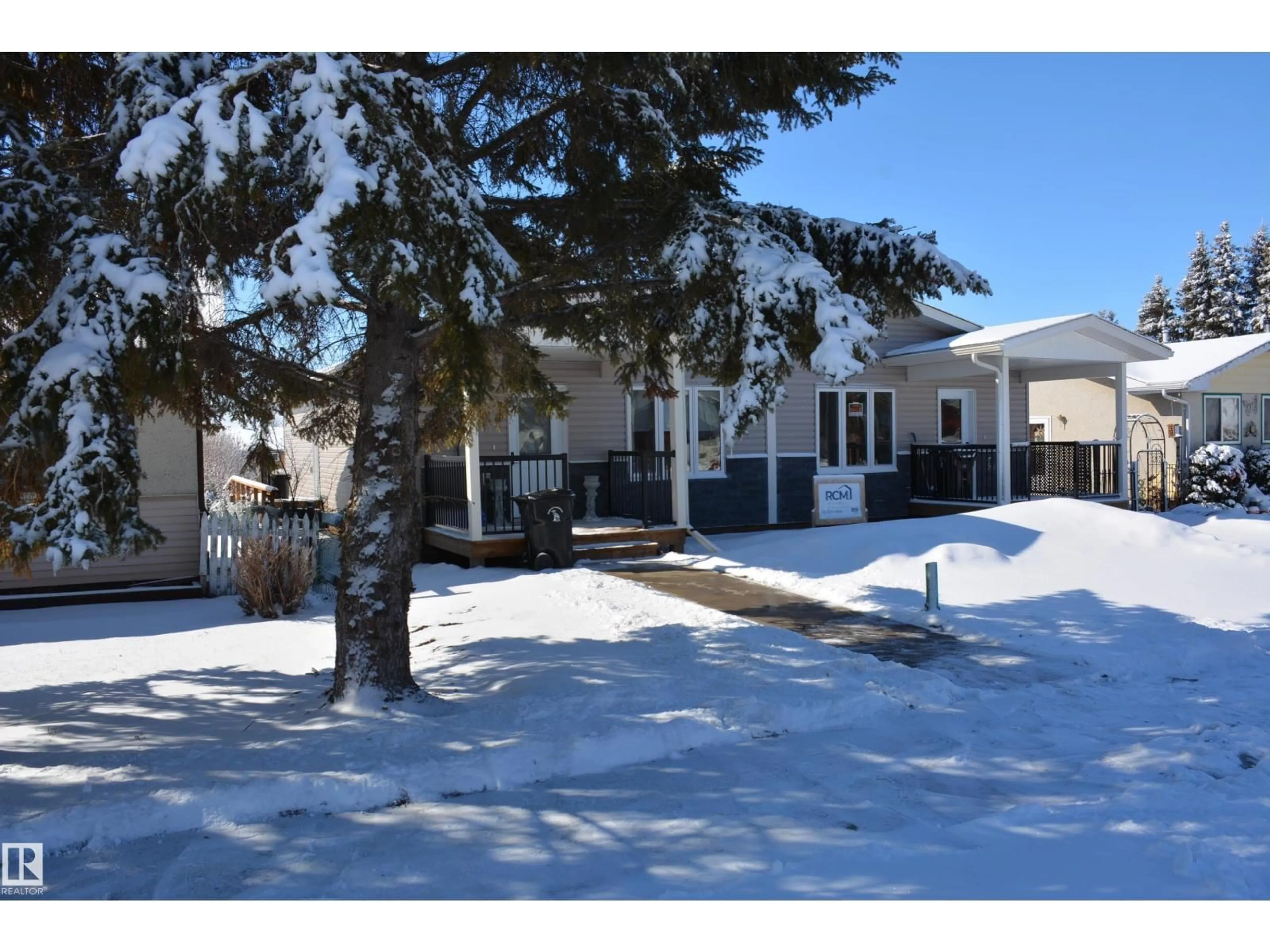 A pic from outside/outdoor area/front of a property/back of a property/a pic from drone, street for B - 4313 54 AV, Barrhead Alberta T7N1J8