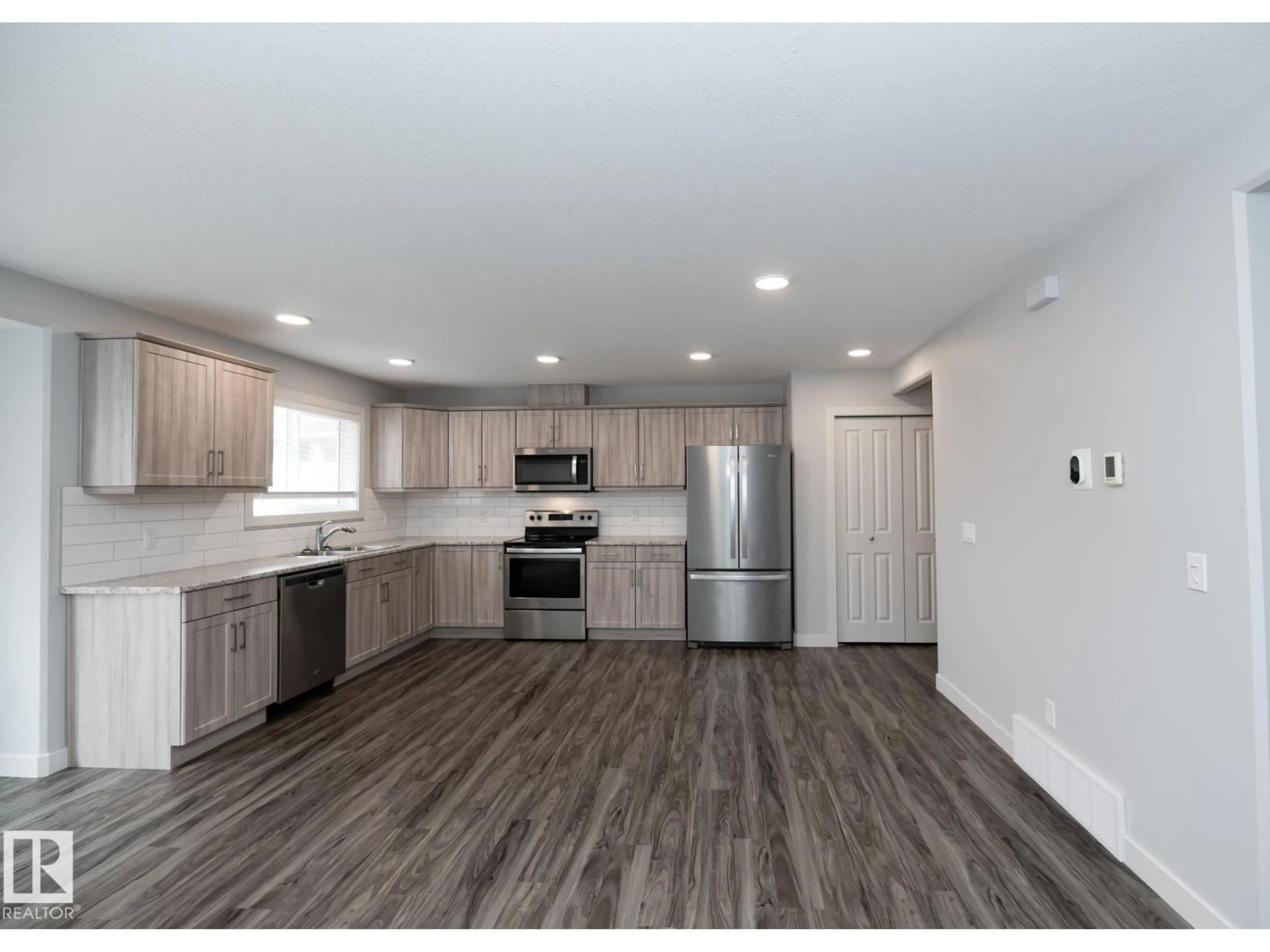Open concept kitchen, wood/laminate floor for 300 - 110 AWENTIA DR, Leduc Alberta T9E1H3
