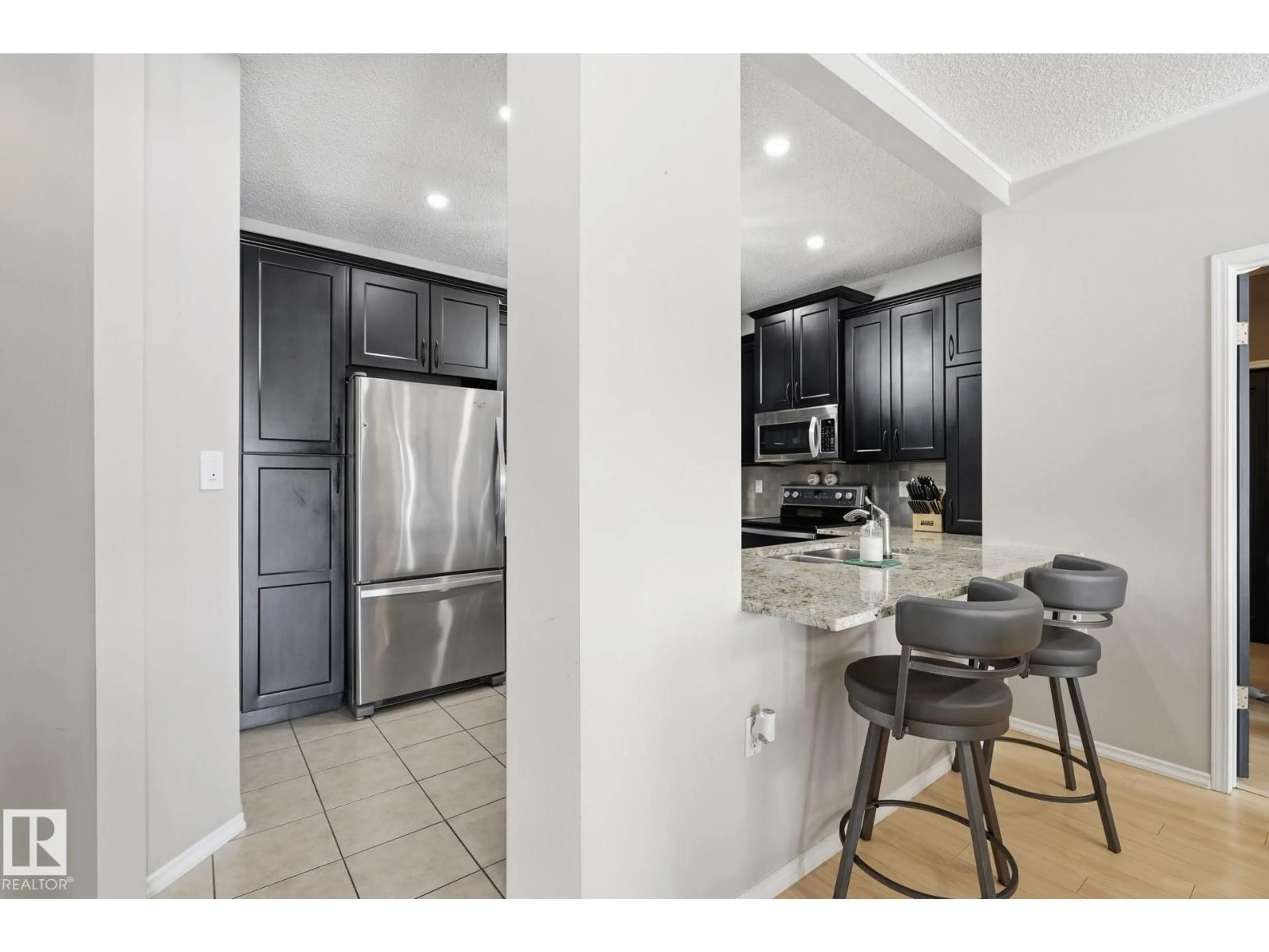 Open concept kitchen, ceramic/tile floor for #334 - 15499 CASTLE DOWNS RD, Edmonton Alberta T5X5Y3