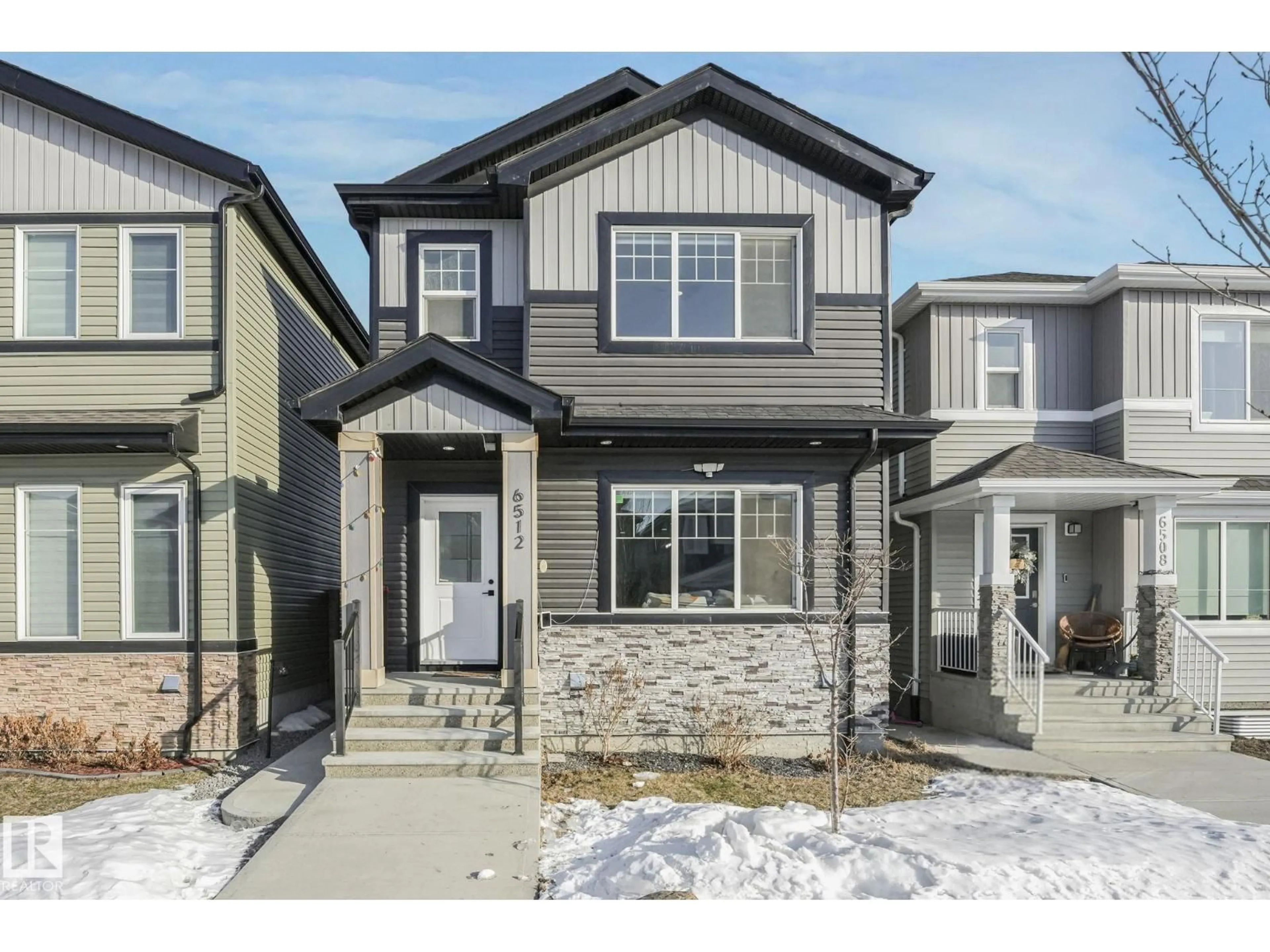 Home with vinyl exterior material, street for 6512 175 AV, Edmonton Alberta T5Y4B3