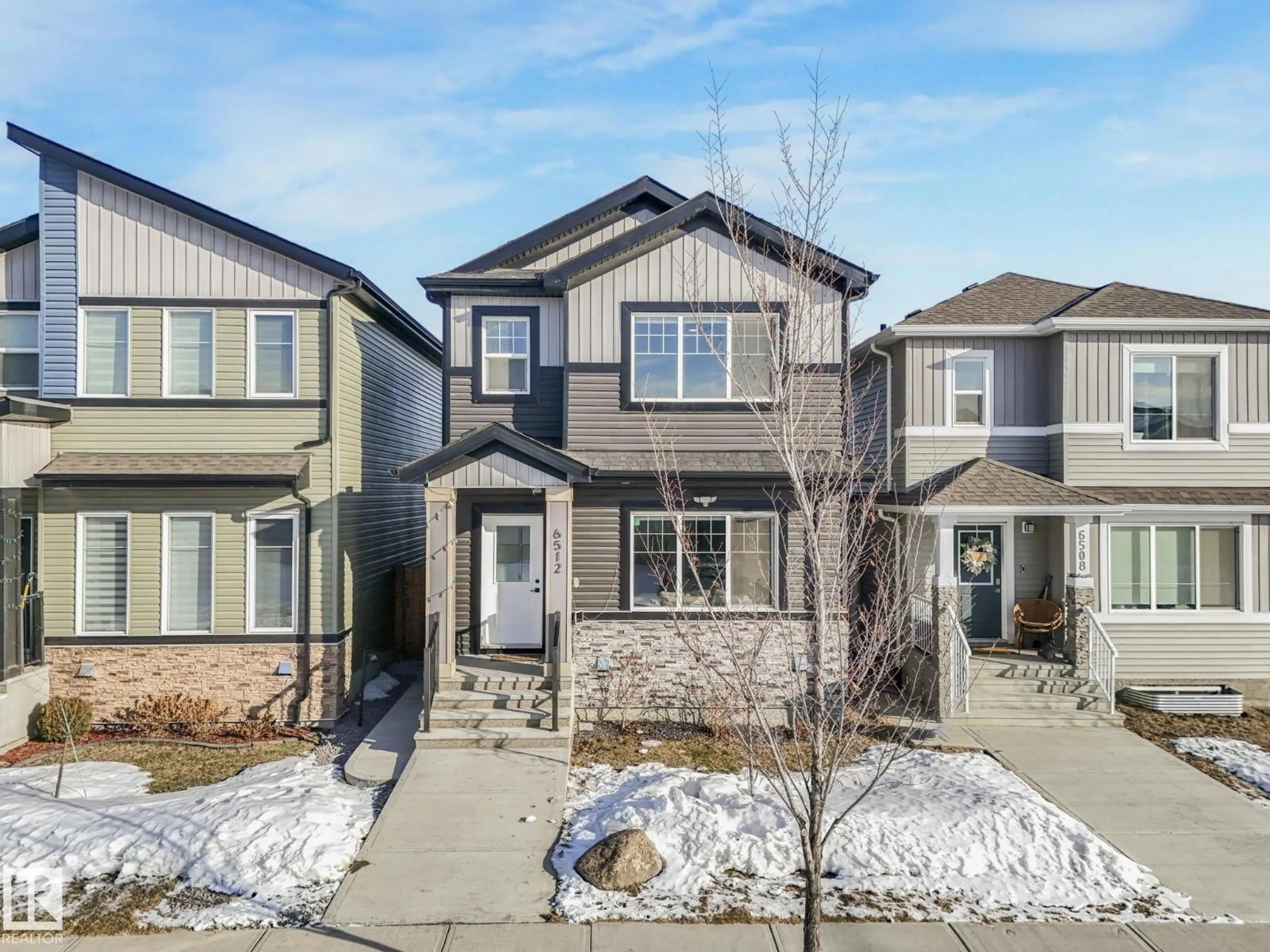 Home with vinyl exterior material, street for 6512 175 AV, Edmonton Alberta T5Y4B3