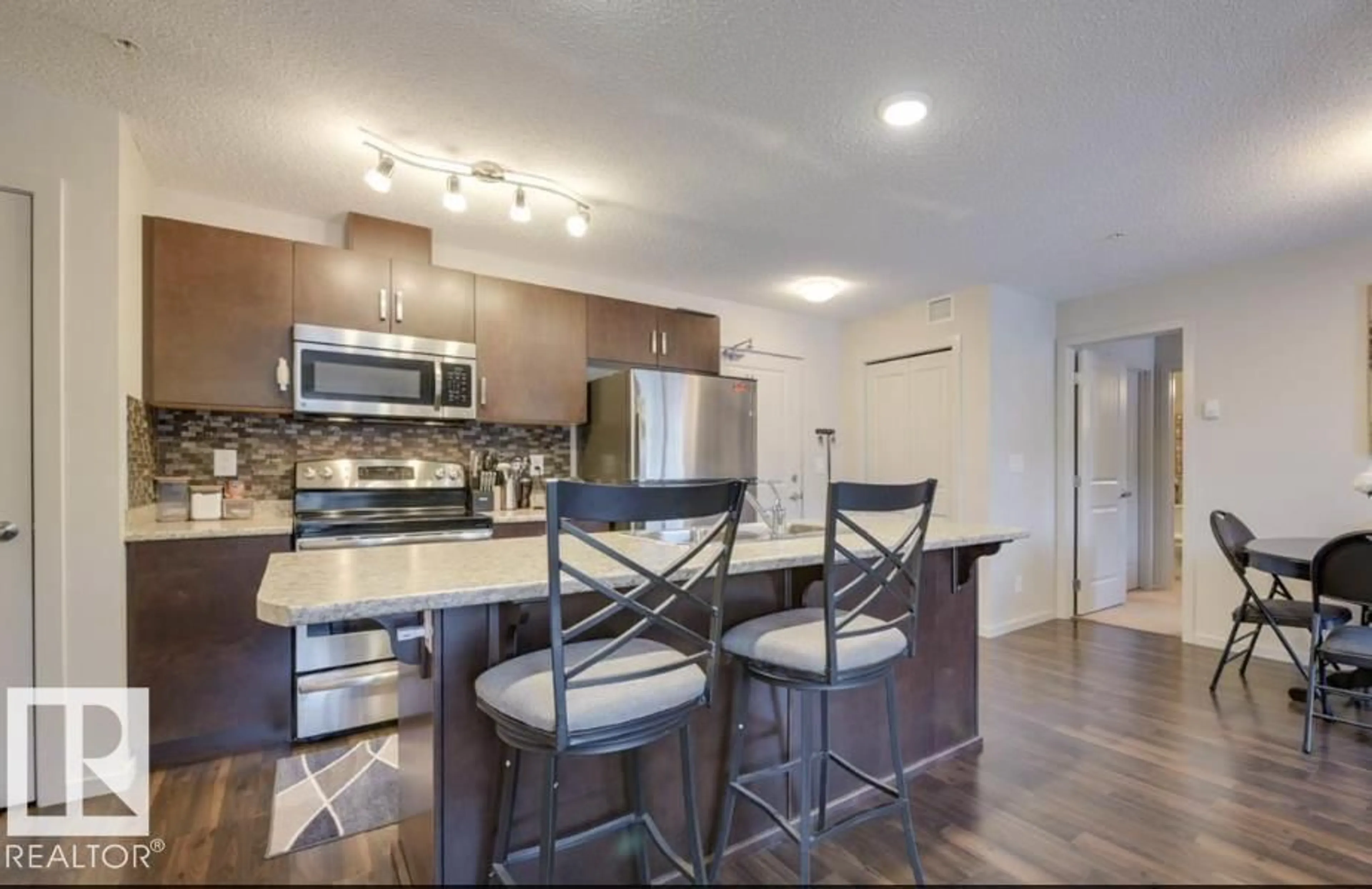 Open concept kitchen, unknown for #207 - 5521 7 AV, Edmonton Alberta T6X2A8