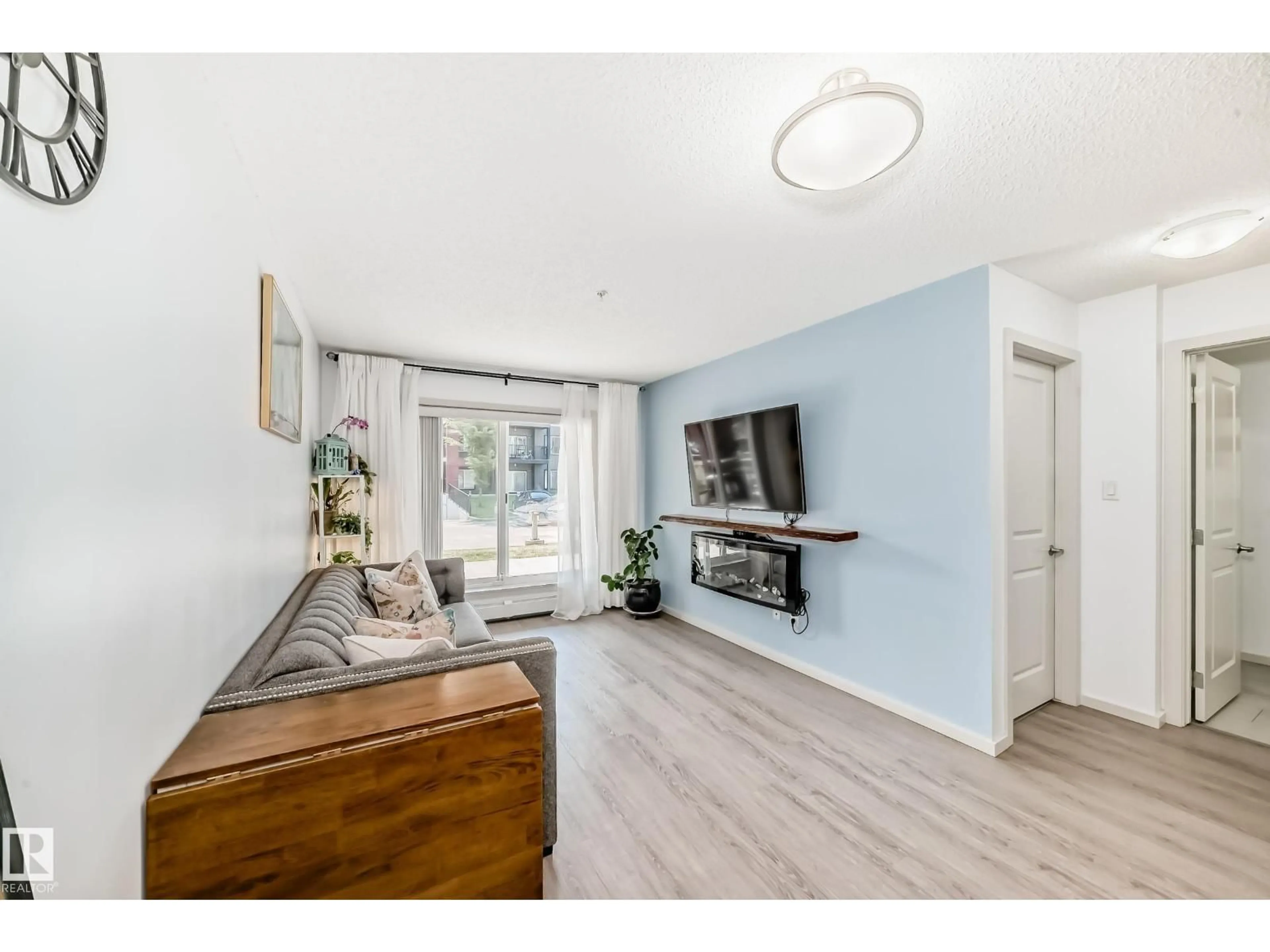 Living room with furniture, wood/laminate floor for 148-348 WINDERMERE RD, Edmonton Alberta T6W2P2