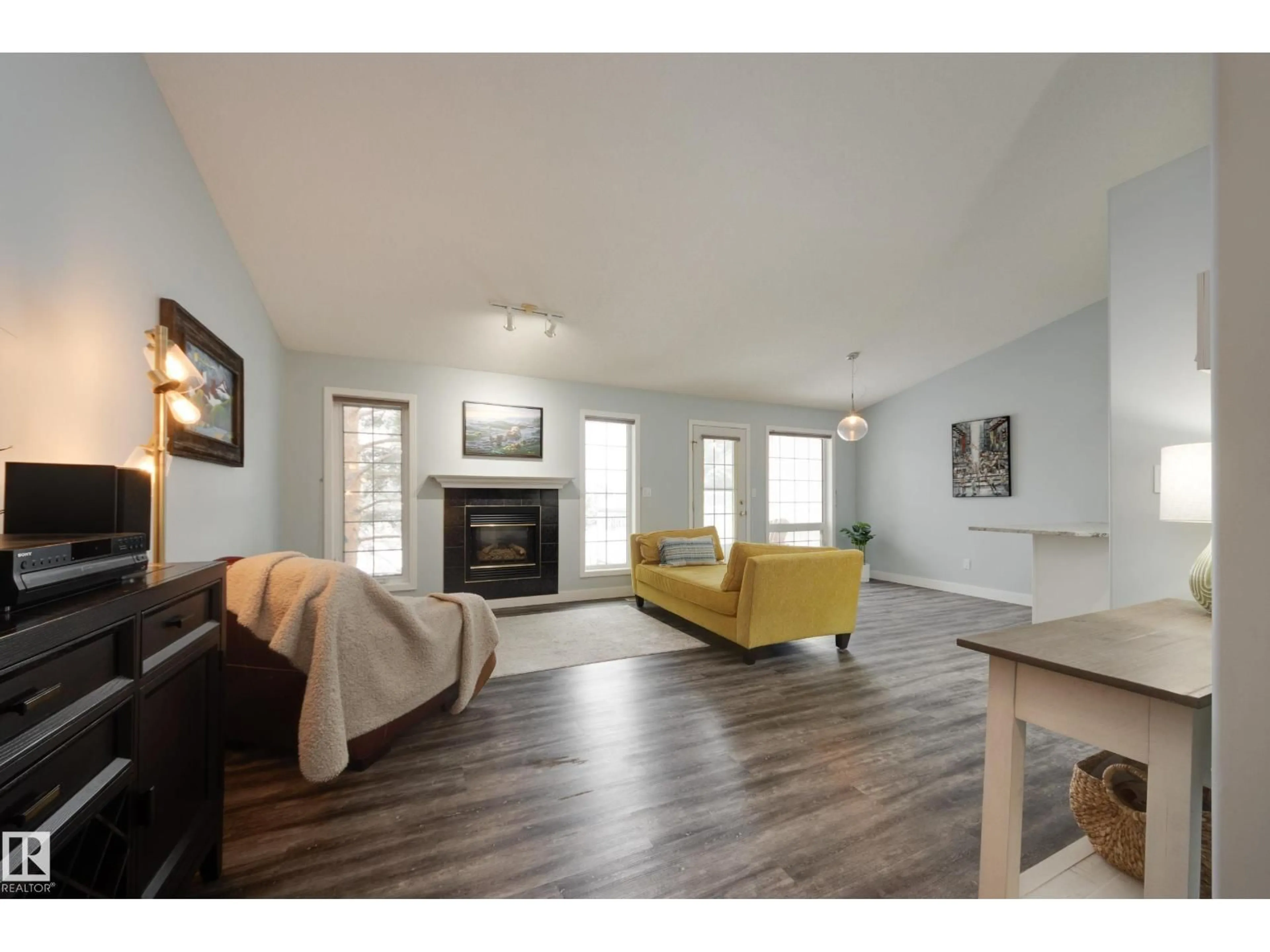 Living room with furniture, wood/laminate floor for 40 - 24 CRANFORD WY, Sherwood Park Alberta T8H2A9