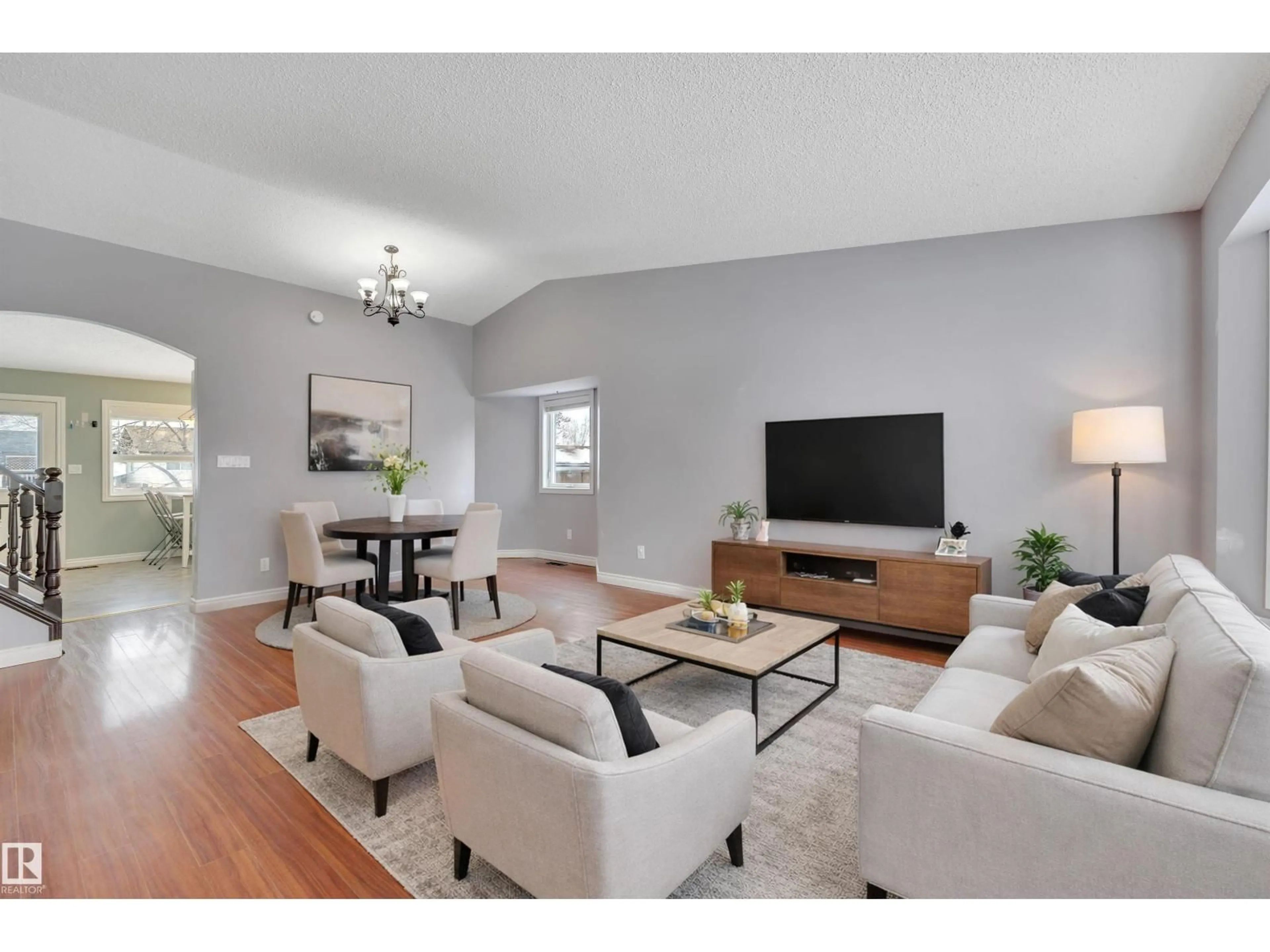 Living room with furniture, wood/laminate floor for 3843 26 AV, Edmonton Alberta T6L4G8