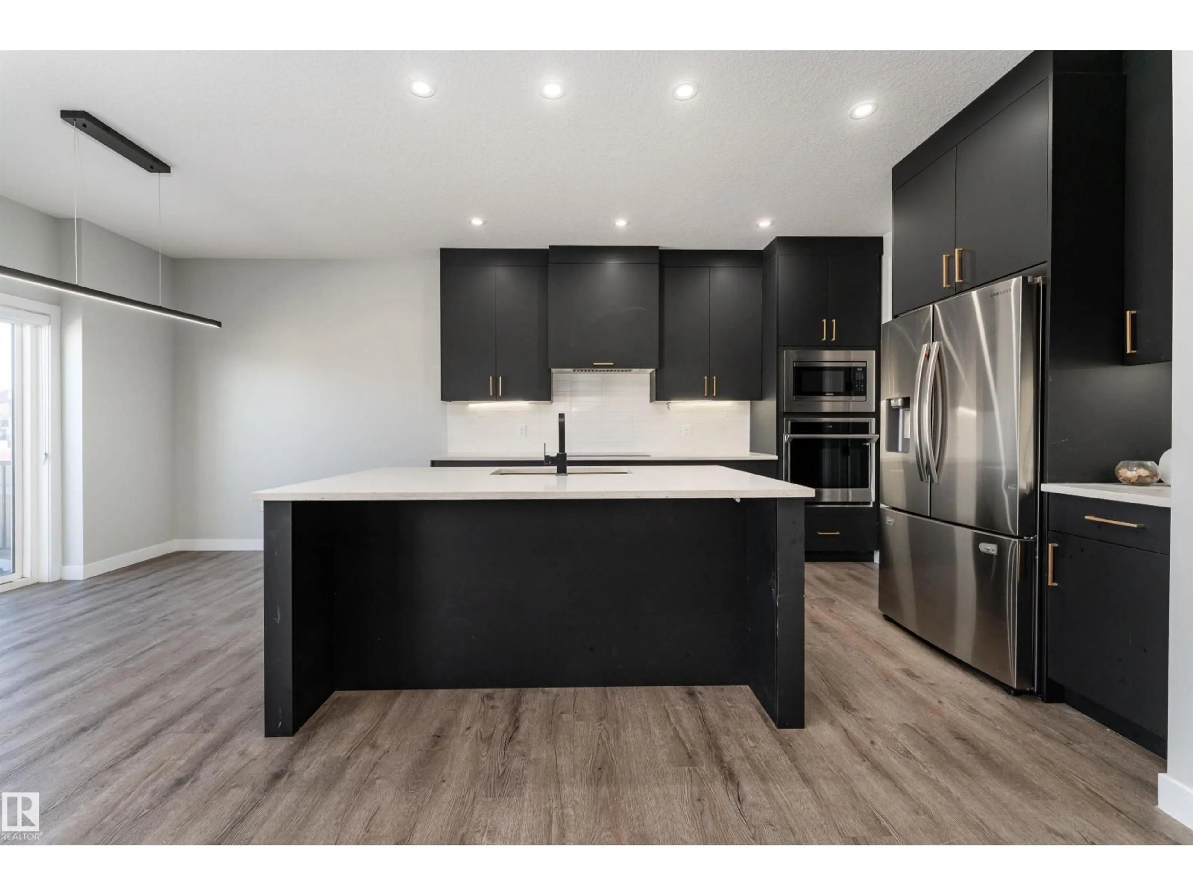 Open concept kitchen, wood/laminate floor for 5211 KIMBALL CR, Edmonton Alberta T6W4Z2