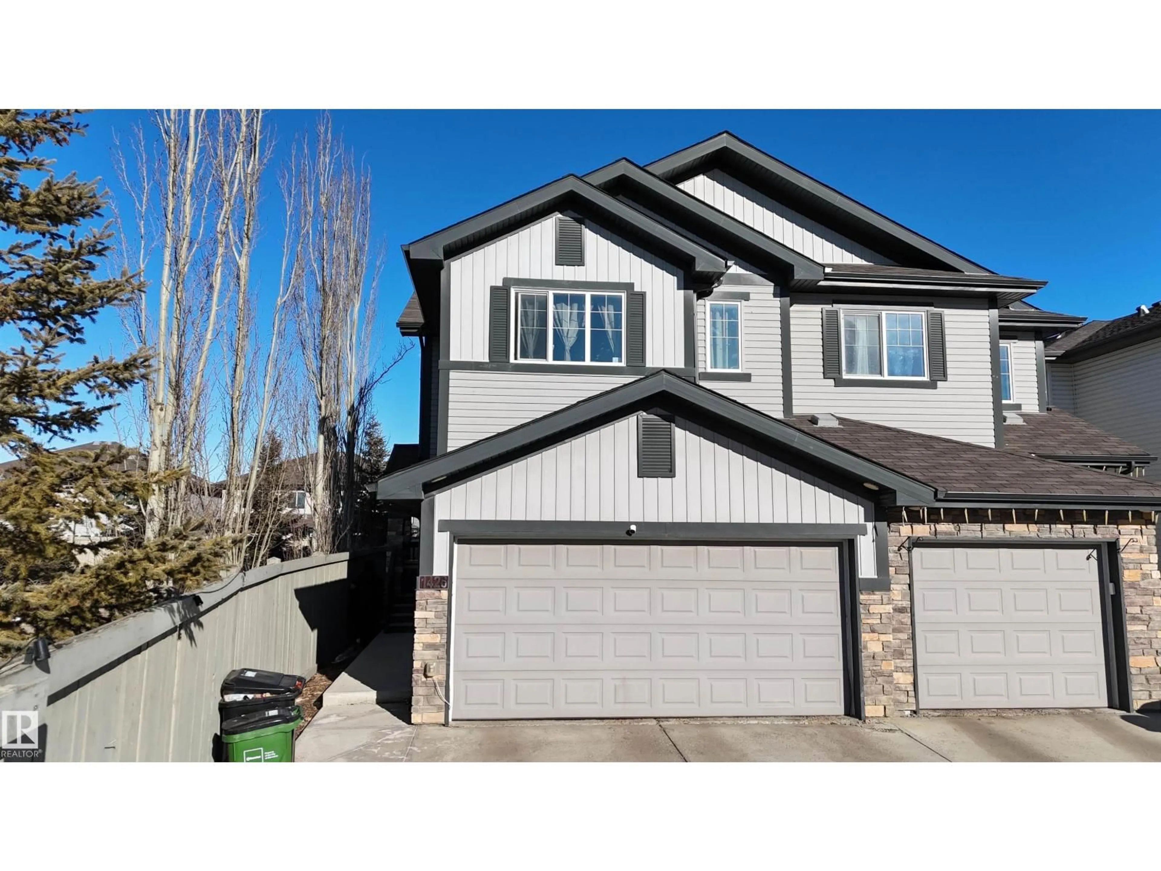 Home with vinyl exterior material, street for 1426 25 AV, Edmonton Alberta T6T2E2