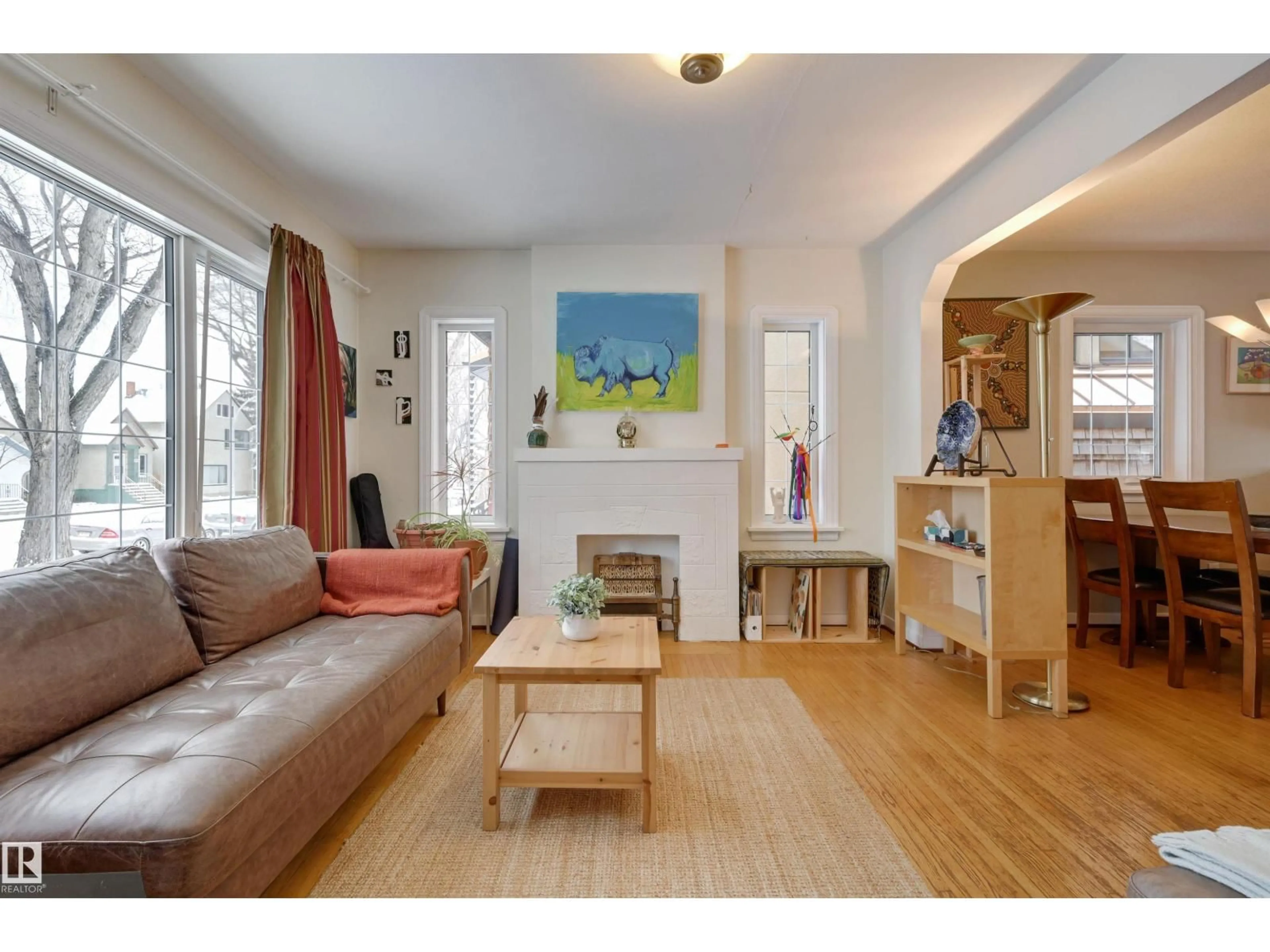 Living room with furniture, wood/laminate floor for NW - 9827 84 AV, Edmonton Alberta T6E2G1