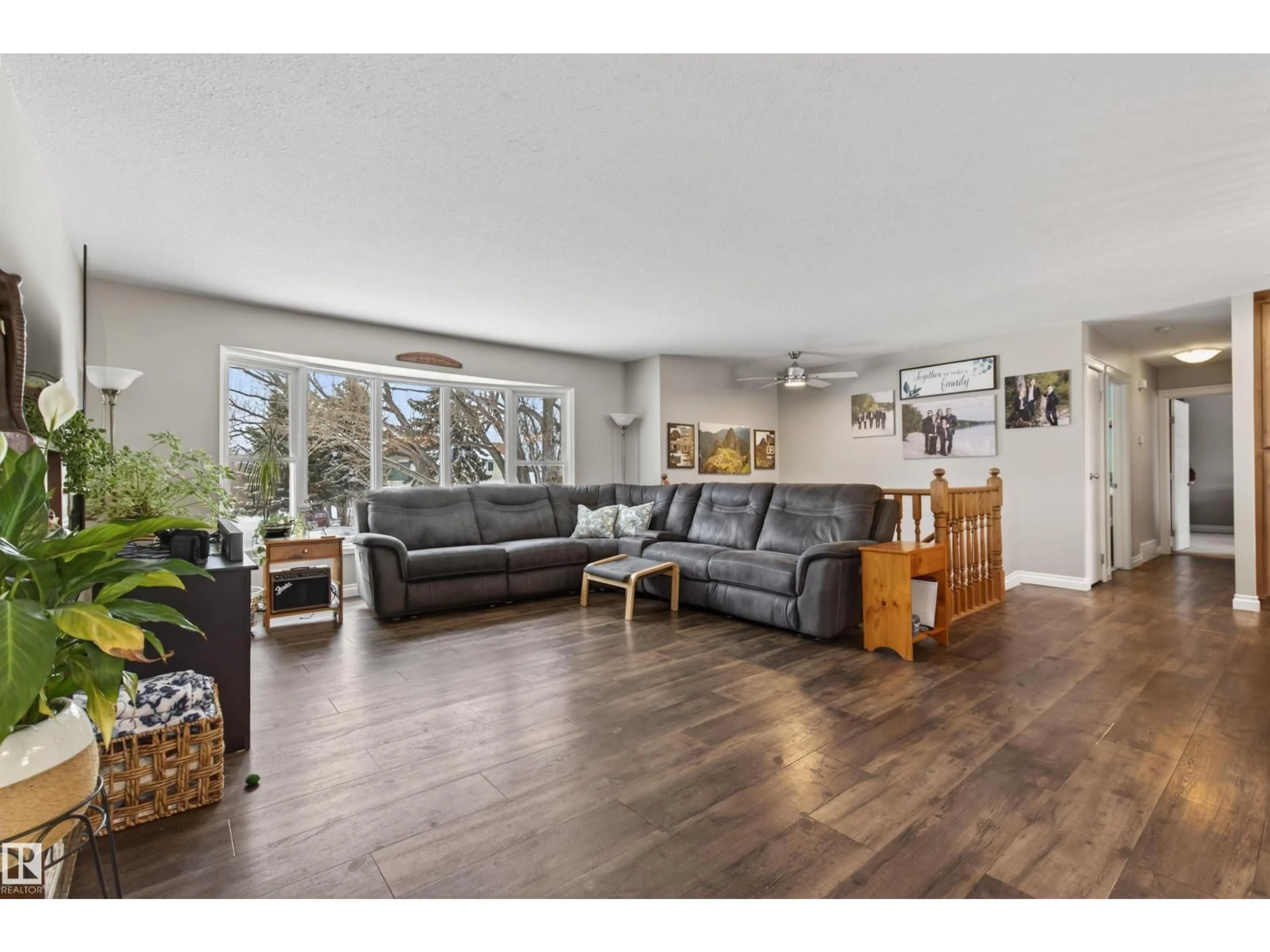 Living room with furniture, wood/laminate floor for 5803 53 AV, Cold Lake Alberta T9M1C8