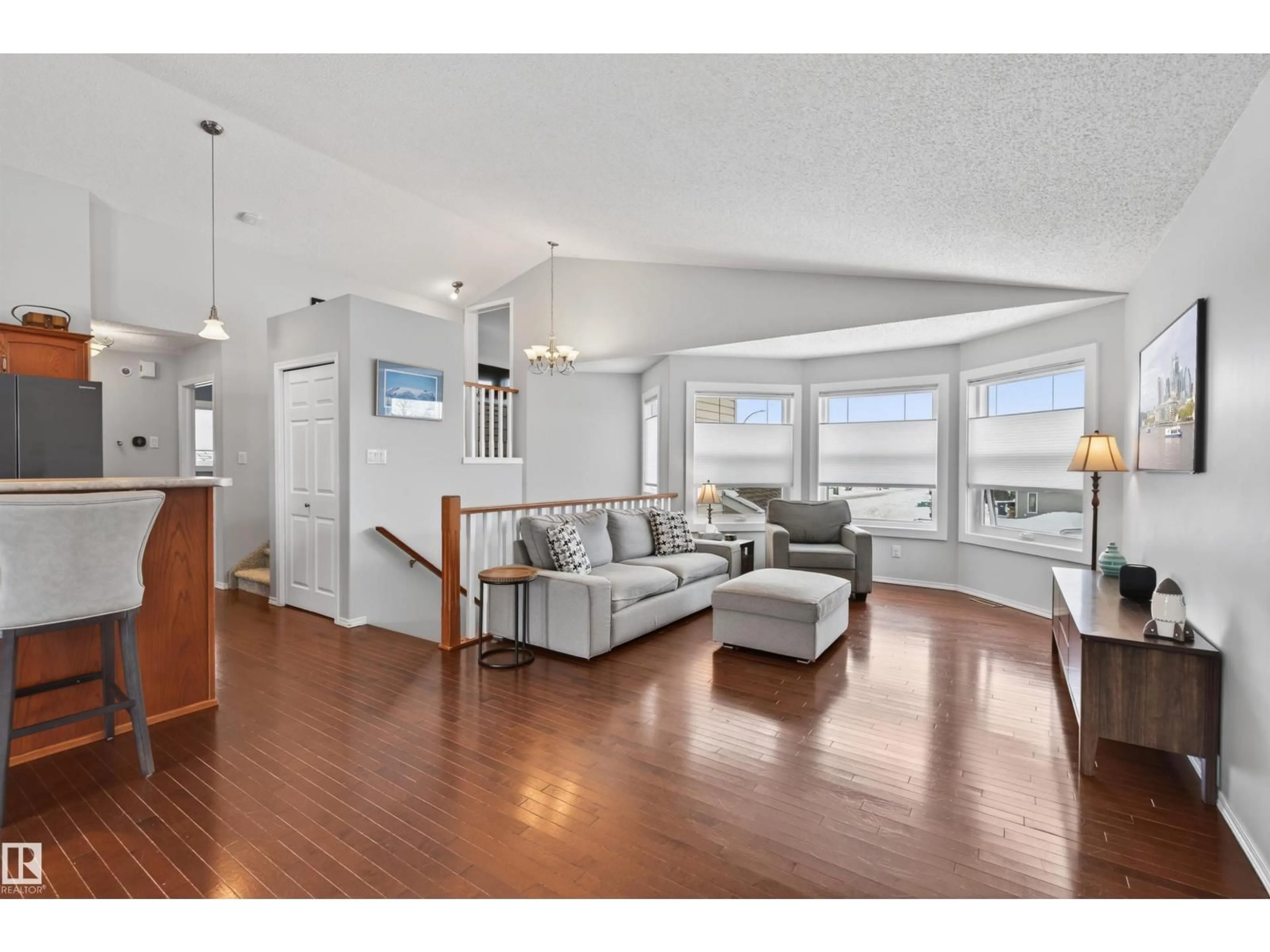 Living room with furniture, wood/laminate floor for 6212 48 ST, Cold Lake Alberta T9M2B6