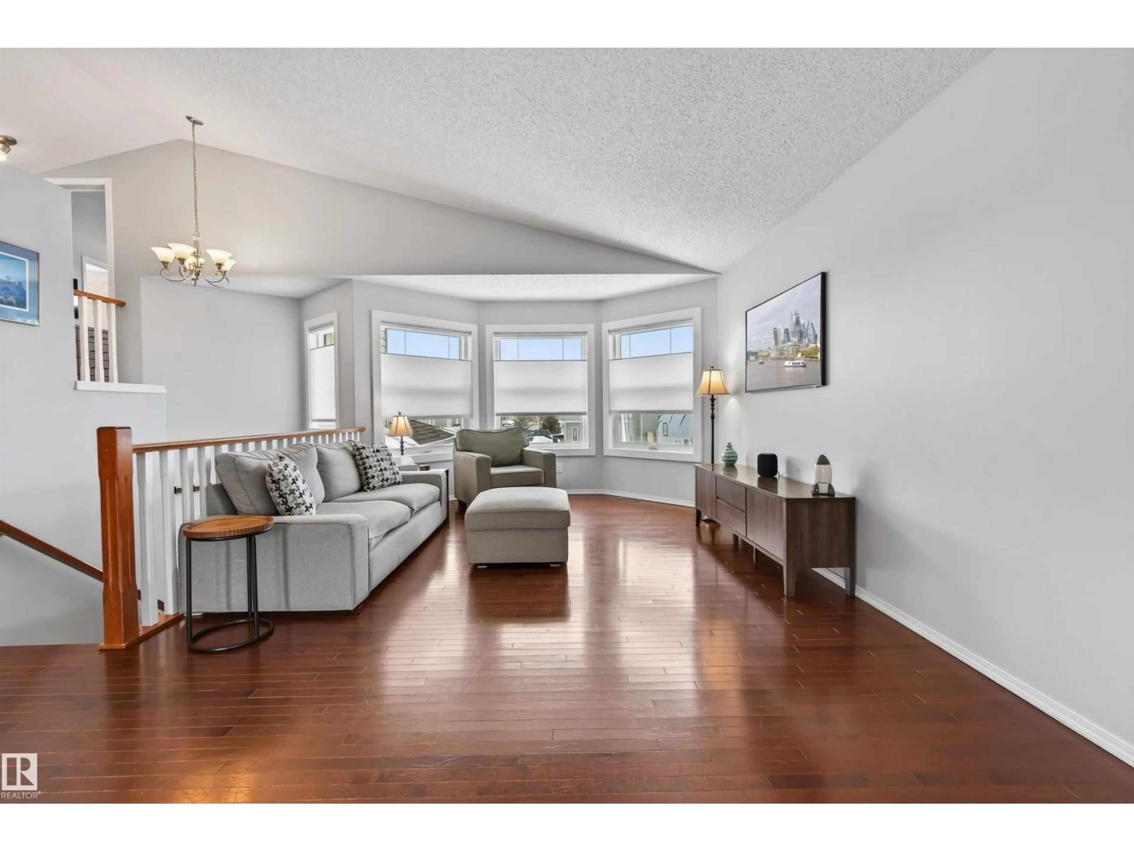 Living room with furniture, wood/laminate floor for 6212 48 ST, Cold Lake Alberta T9M2B6