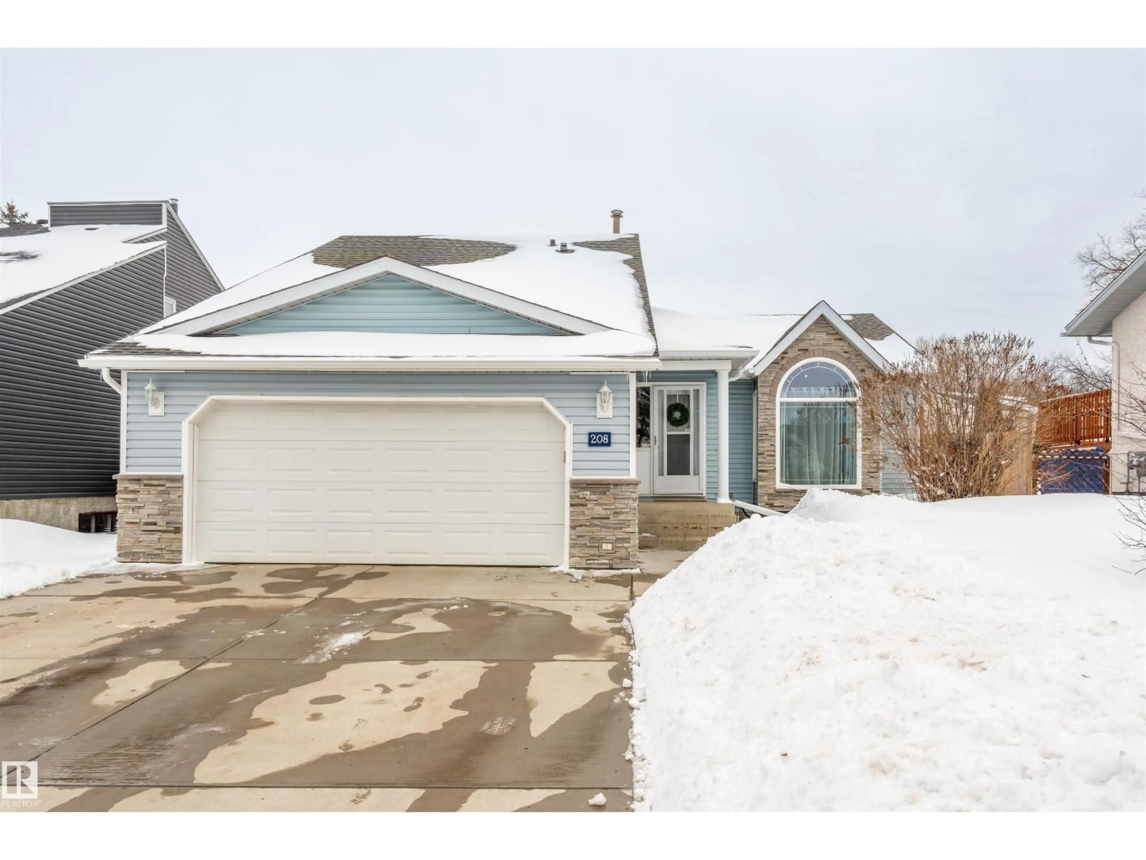 Home with vinyl exterior material, street for 208 20A ST, Cold Lake Alberta T9M1G3