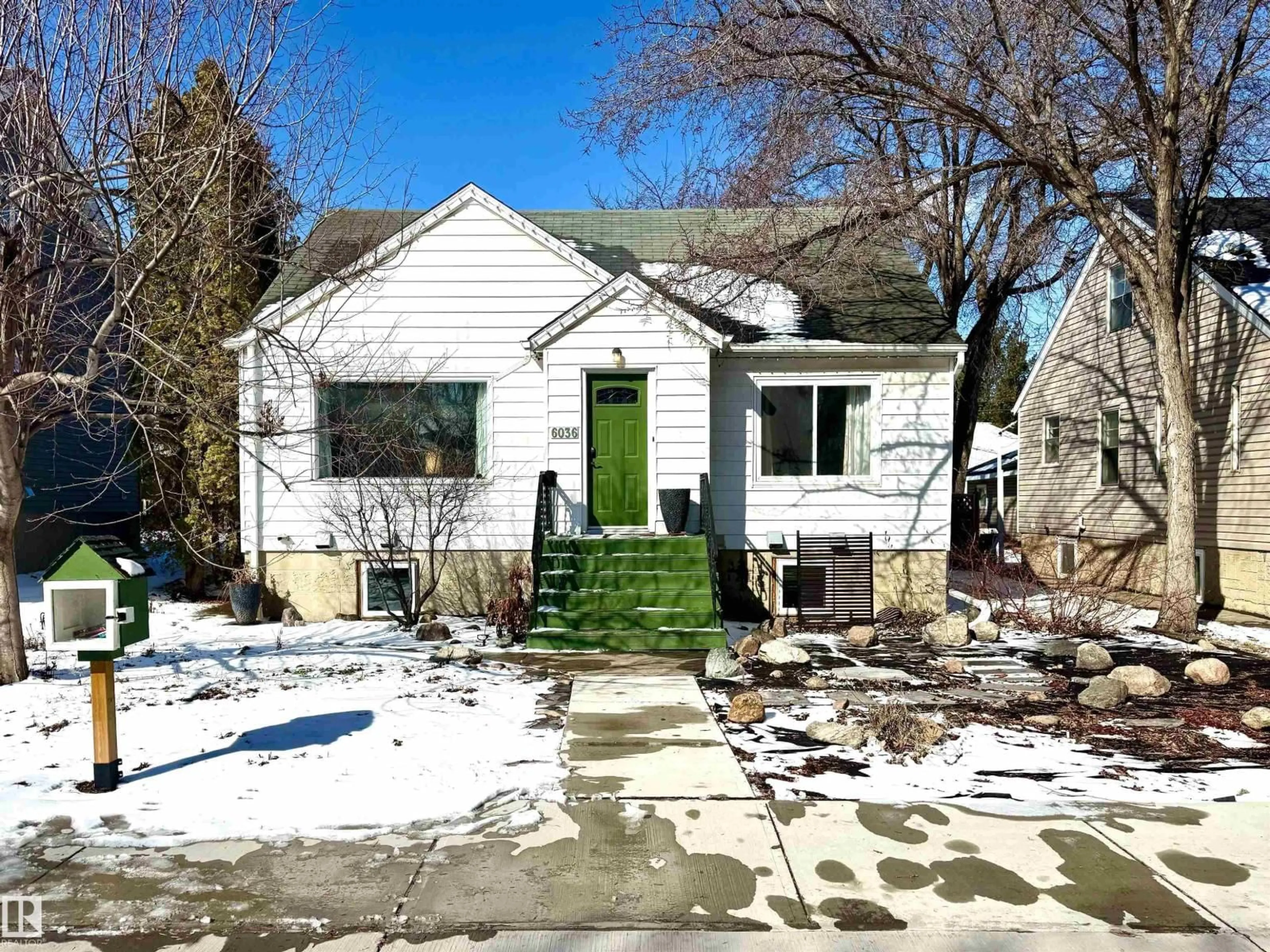 Home with vinyl exterior material, street for NW - 7408 86 AV, Edmonton Alberta T6H2T7