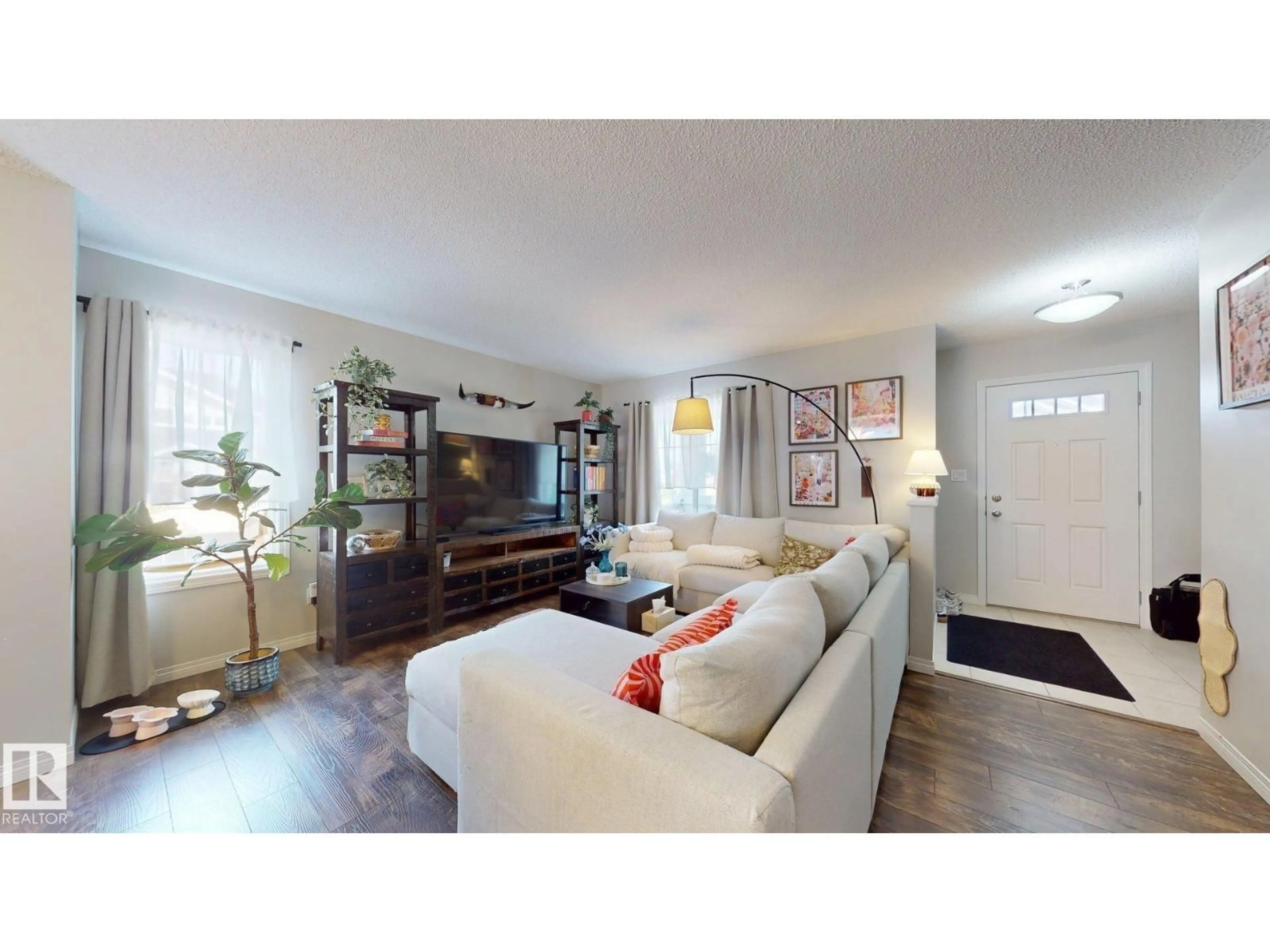 Living room with furniture, wood/laminate floor for 1275 CHAPPELLE BV, Edmonton Alberta T6W3R1