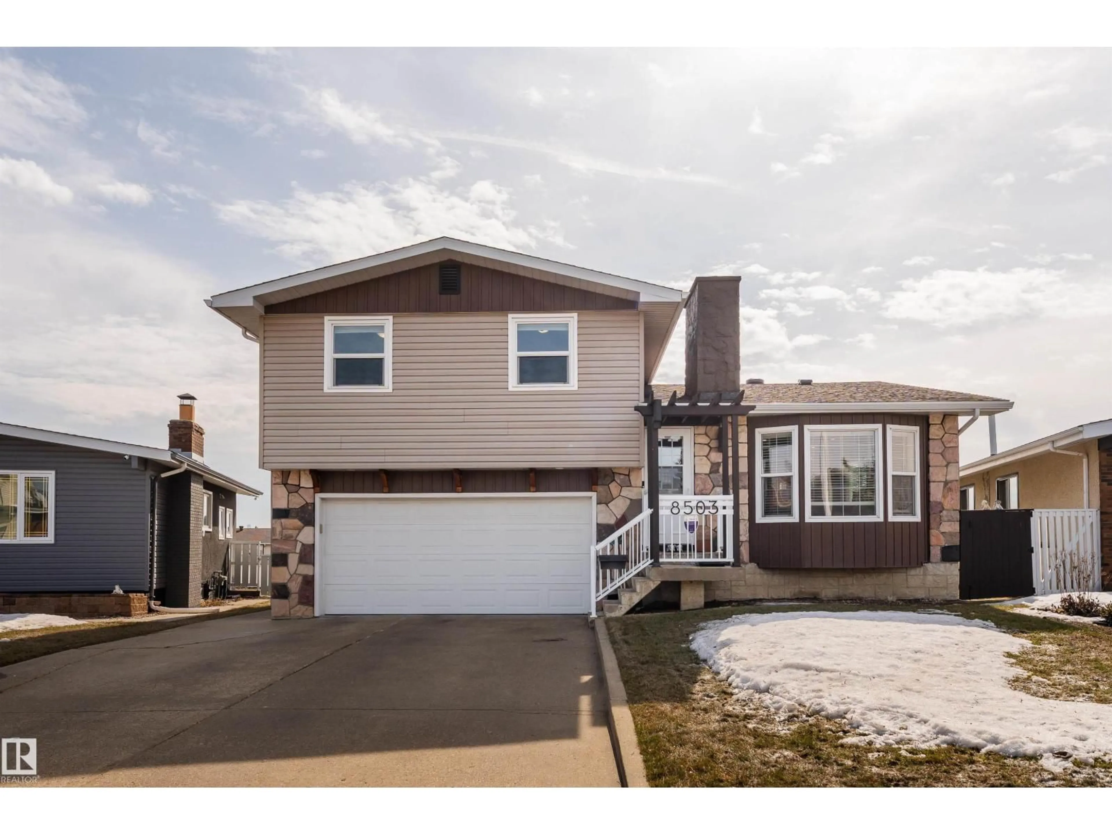 Home with vinyl exterior material, street for 8503 151 AV, Edmonton Alberta T5E5Y1