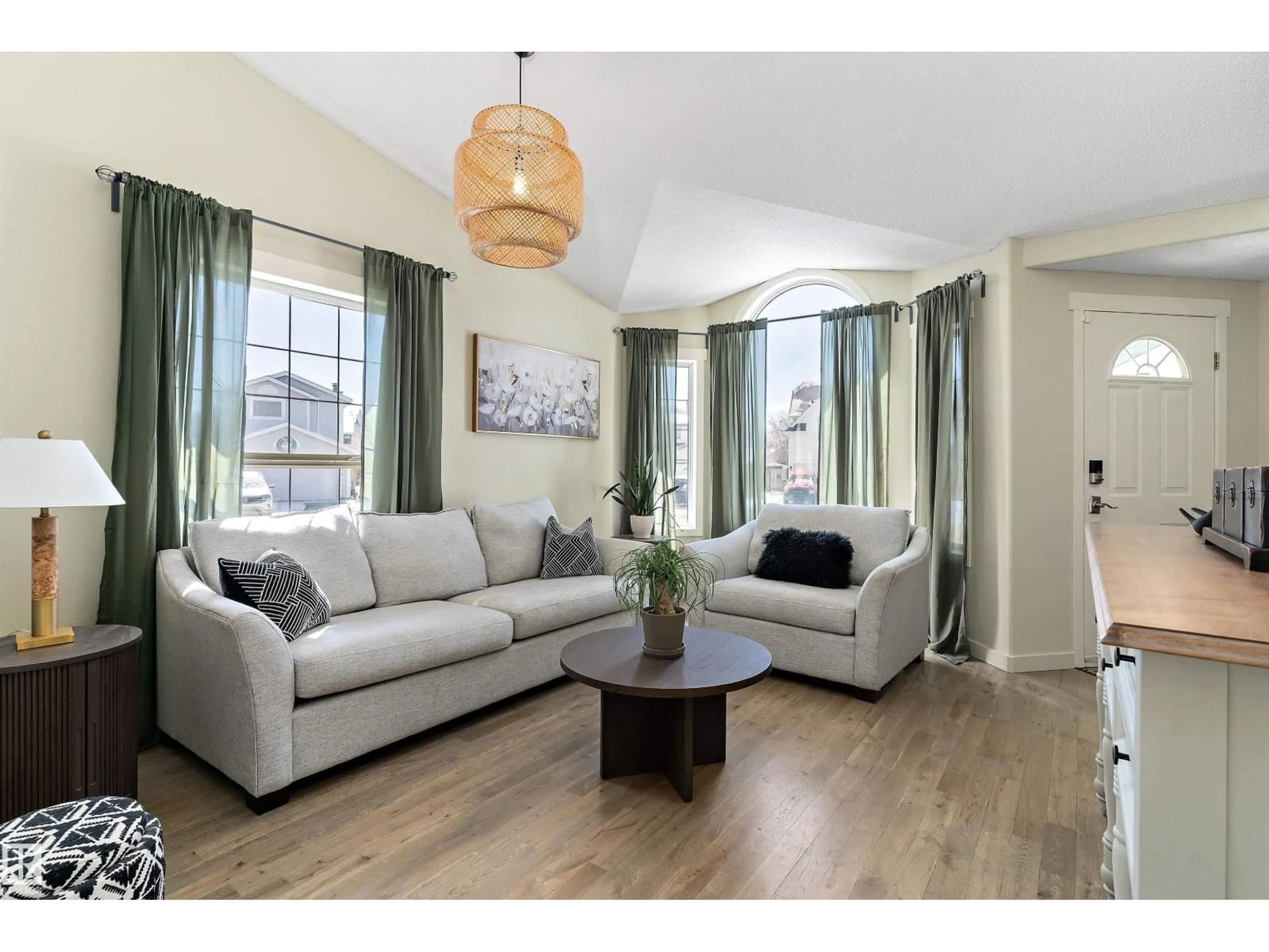 Living room with furniture, wood/laminate floor for 84 DELAGE CR, St. Albert Alberta T8N5Y8