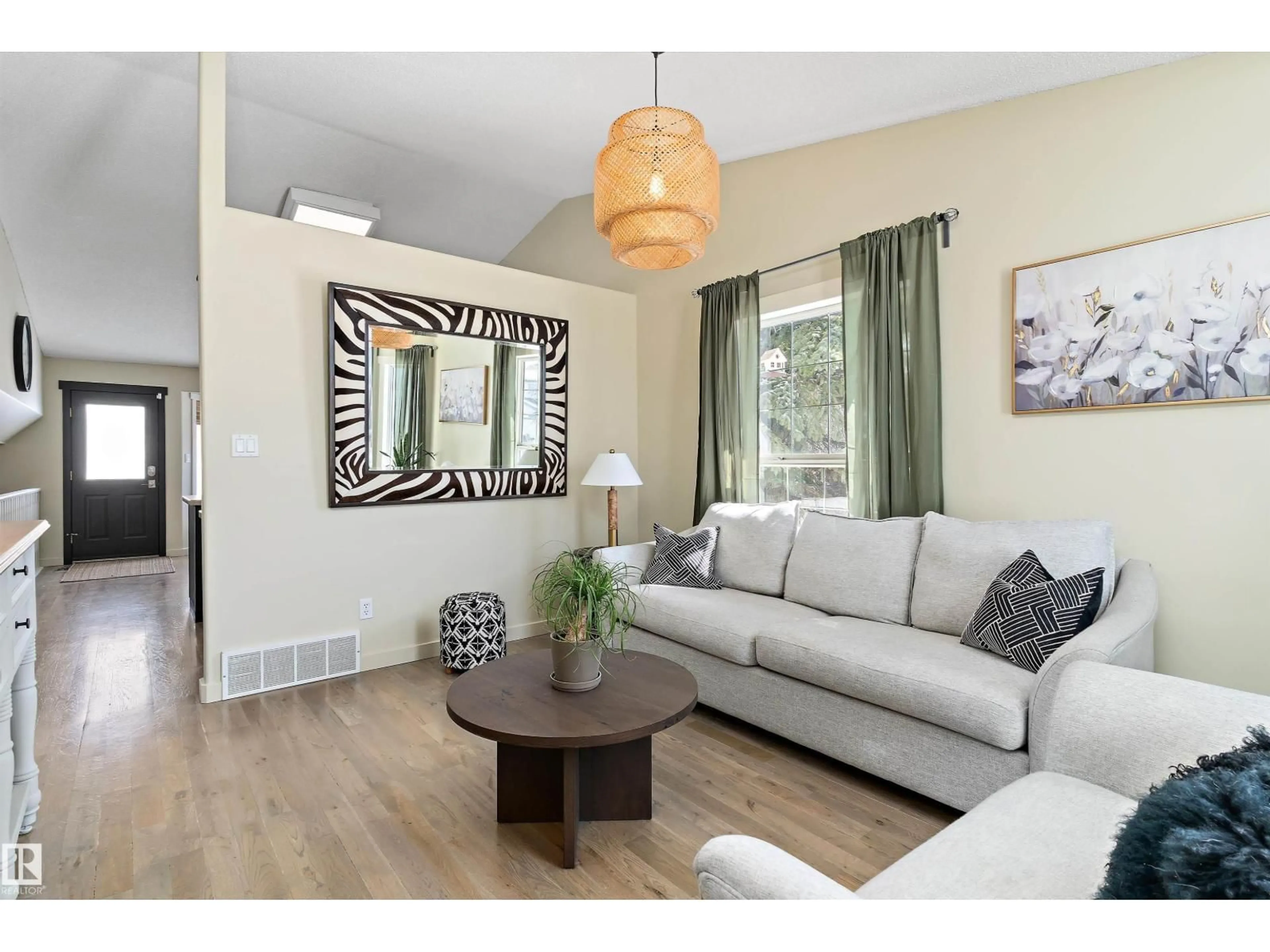 Living room with furniture, wood/laminate floor for 84 DELAGE CR, St. Albert Alberta T8N5Y8