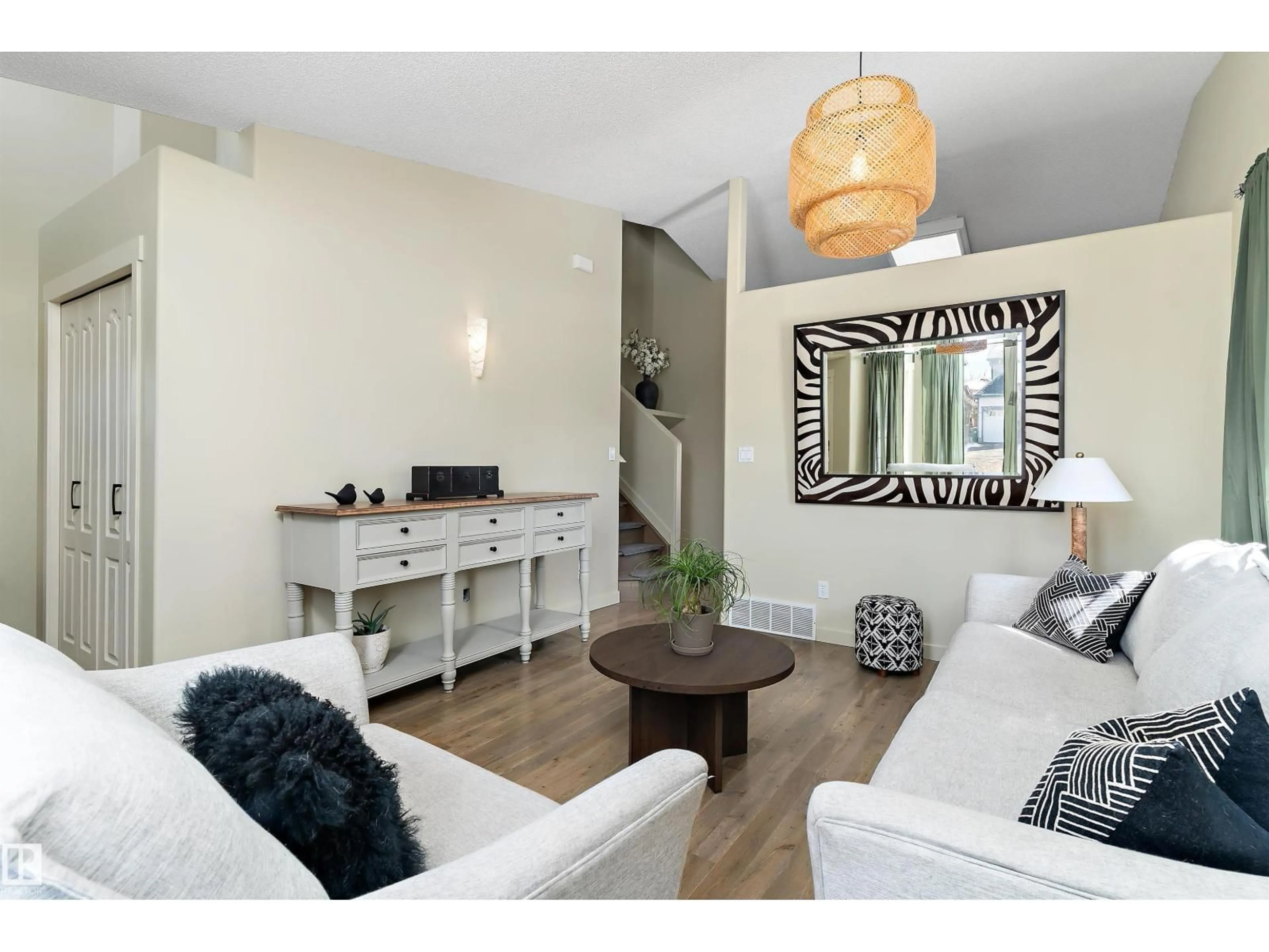 Living room with furniture, wood/laminate floor for 84 DELAGE CR, St. Albert Alberta T8N5Y8