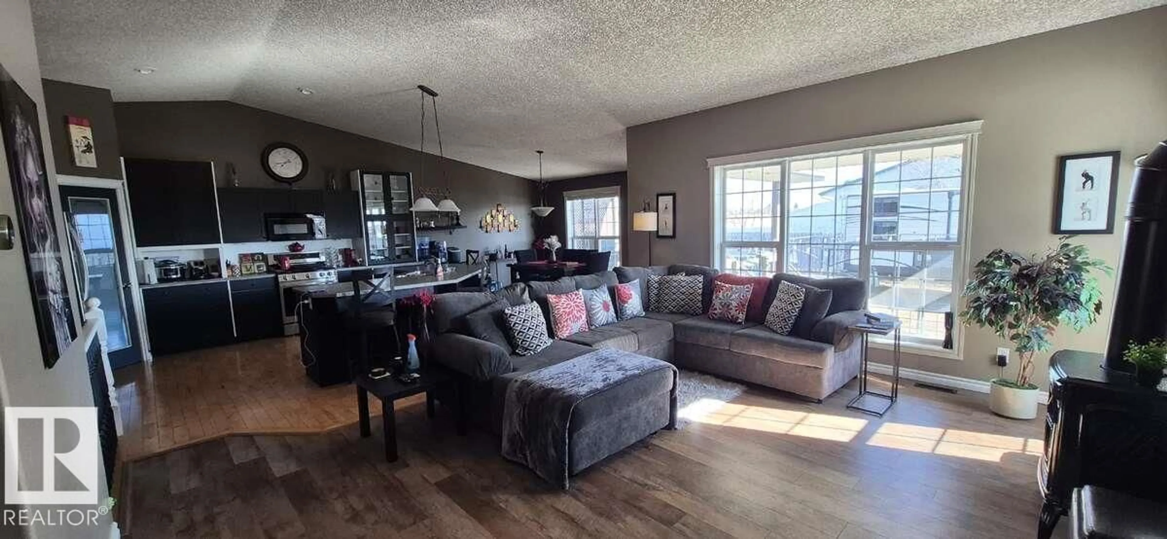Living room with furniture, wood/laminate floor for 4235 55 AV, Tofield Alberta T0B4J0