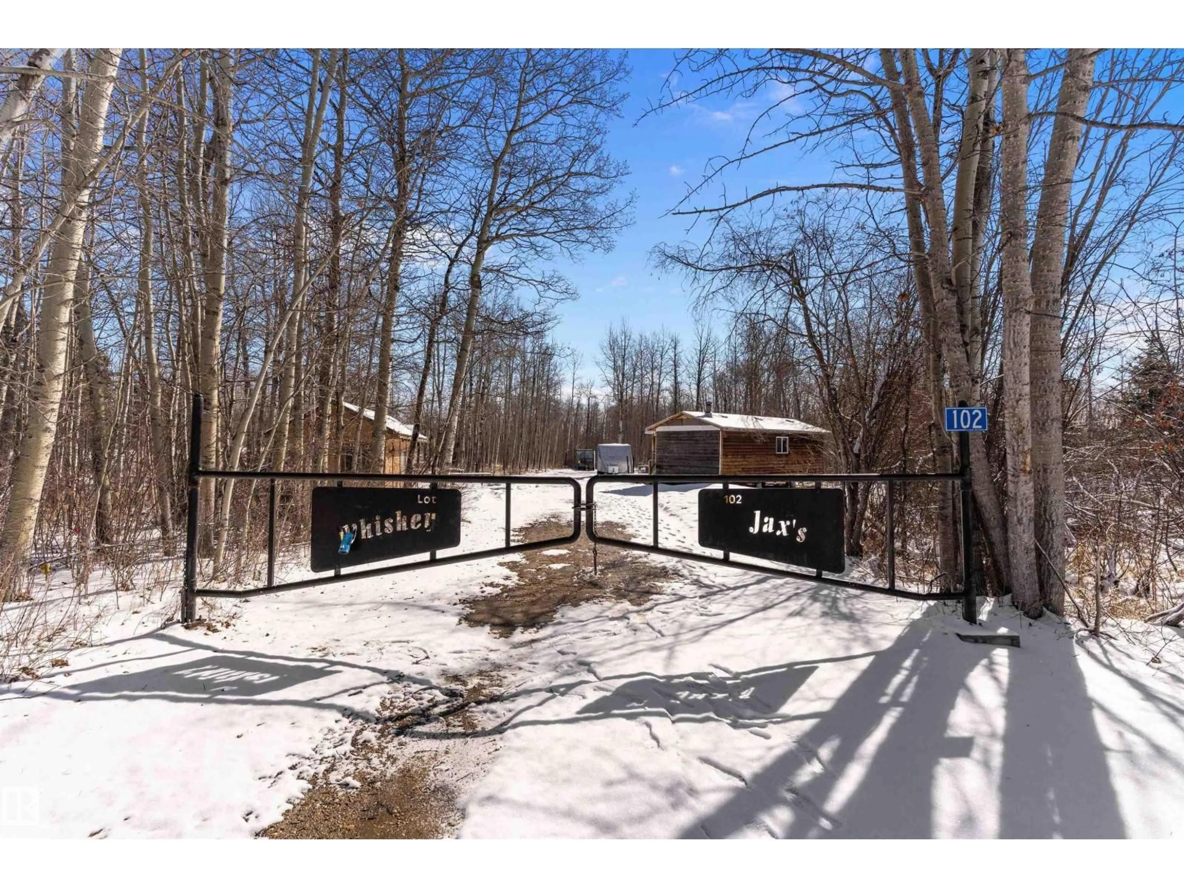 A pic from outside/outdoor area/front of a property/back of a property/a pic from drone, forest/trees view for #102 - 5124 TWP ROAD 554, Rural Lac Ste. Anne County Alberta T0E0L0