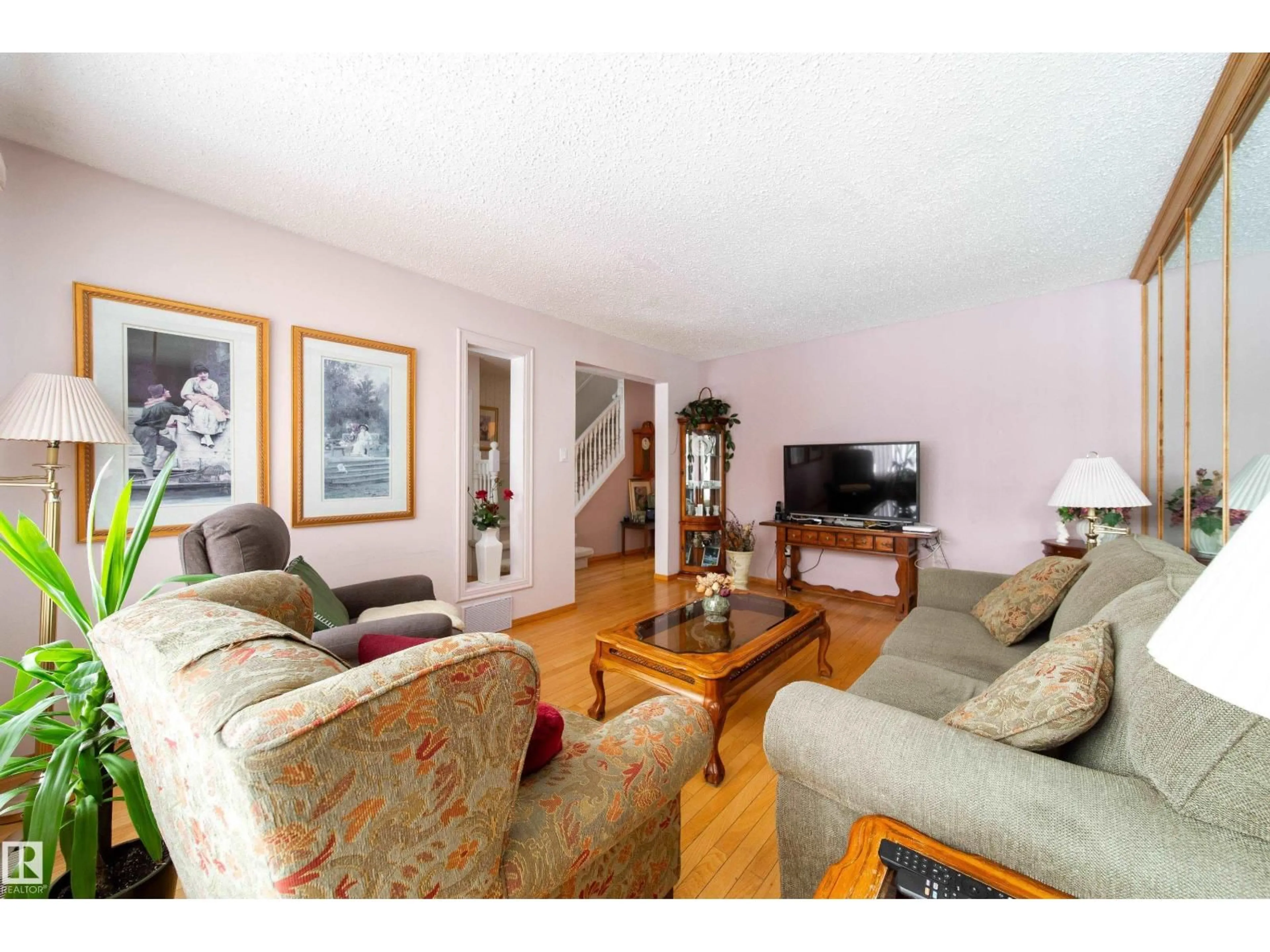 Living room with furniture, wood/laminate floor for 11 GRANADA PL, St. Albert Alberta T8N3C3