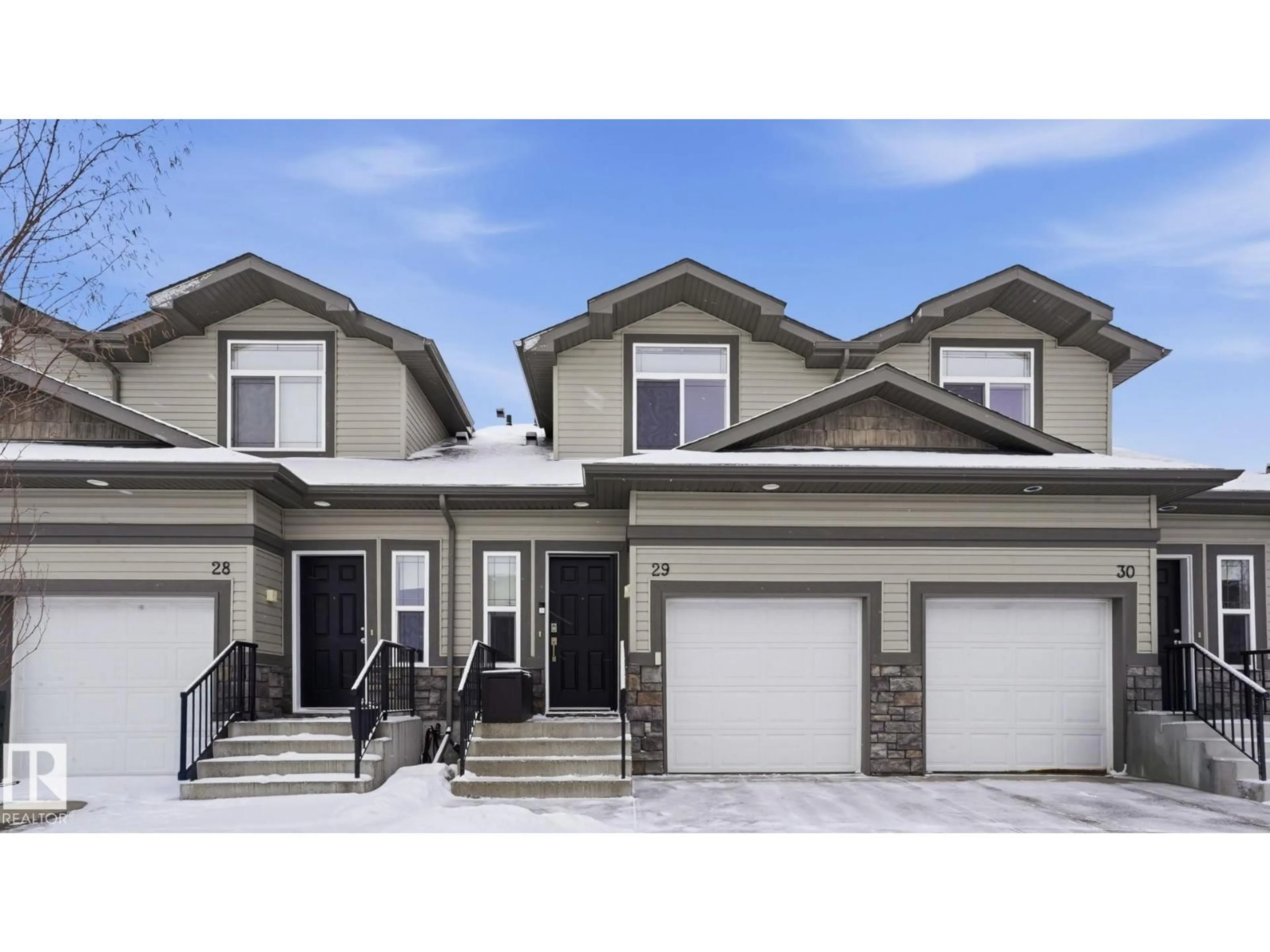 Home with vinyl exterior material, street for 29 9511 102 AV NW, Morinville Alberta T8R0C6