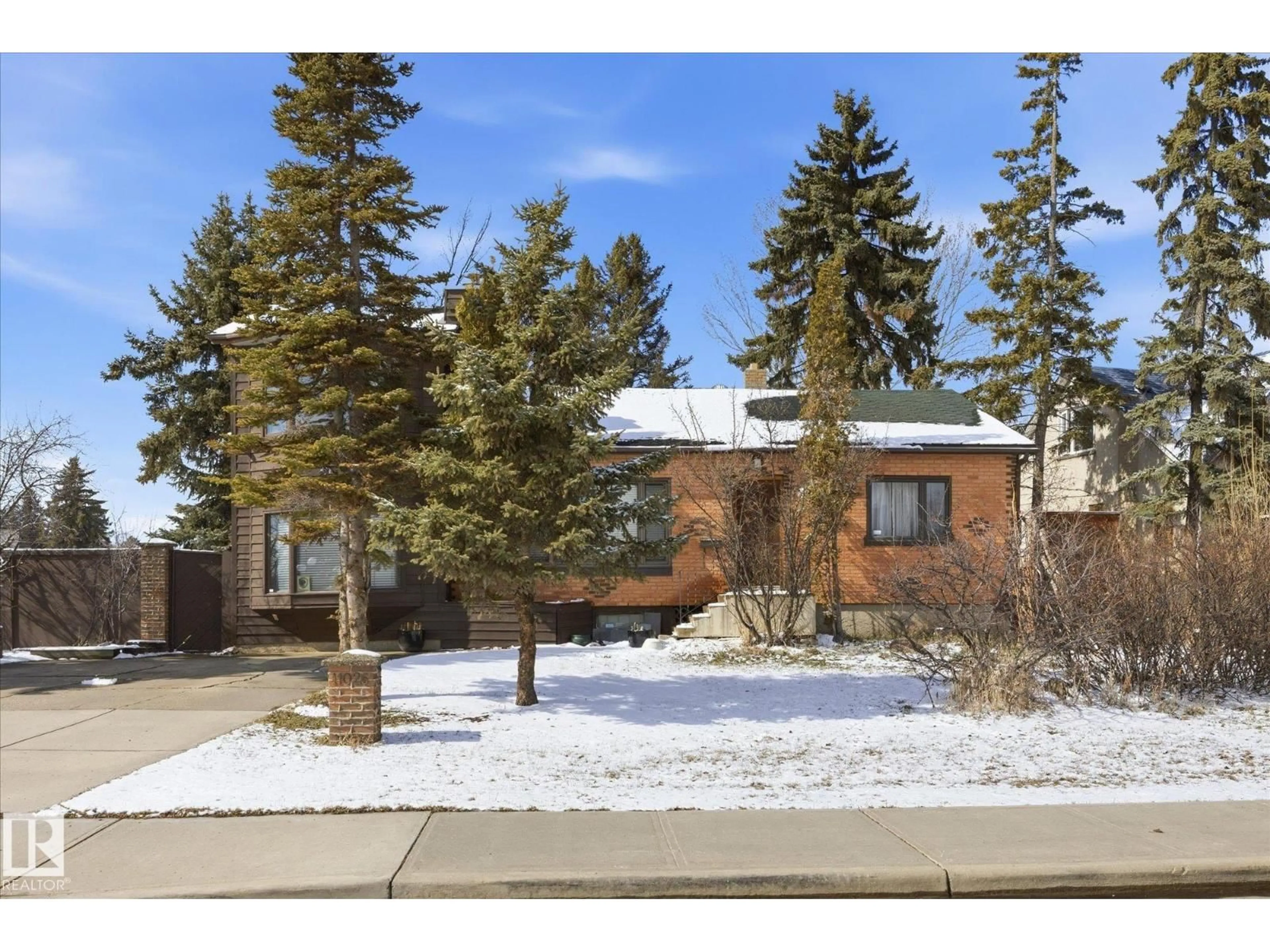 Home with brick exterior material, street for 11026 110 AV NW, Edmonton Alberta T5H1H9