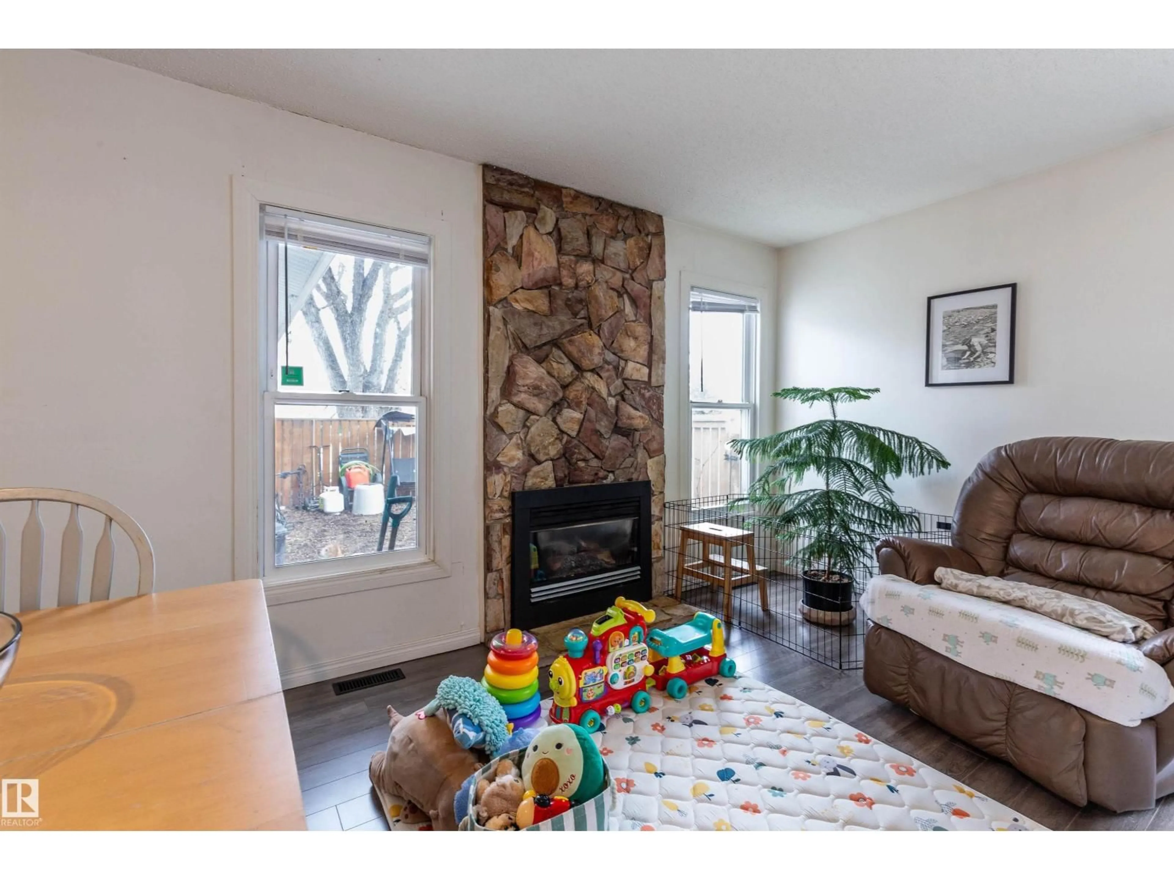 Living room with furniture, wood/laminate floor for 6504 184 ST, Edmonton Alberta T5T1Z5