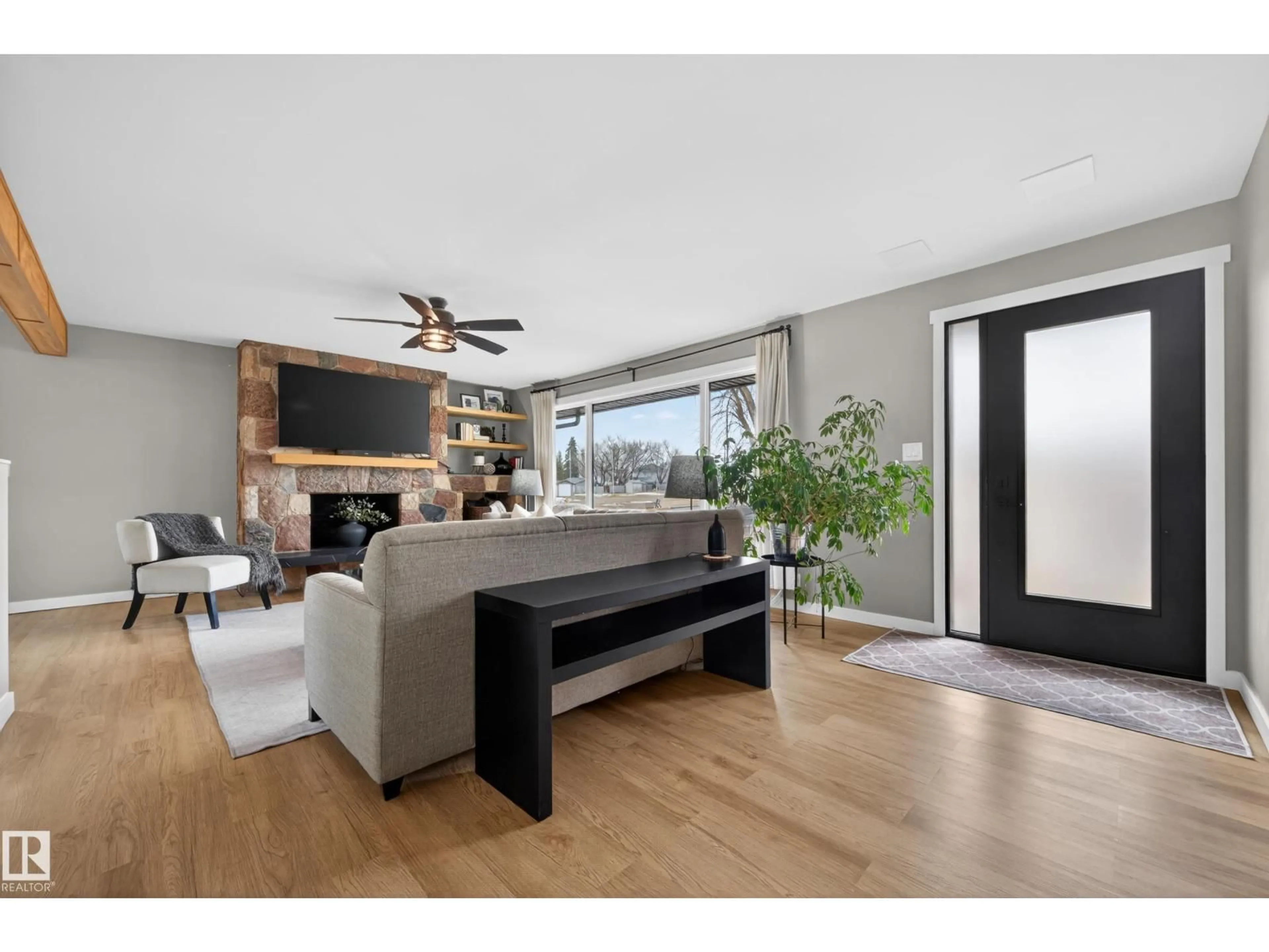 Living room with furniture, wood/laminate floor for 4908 50 AV, Bruderheim Alberta T0B0S0