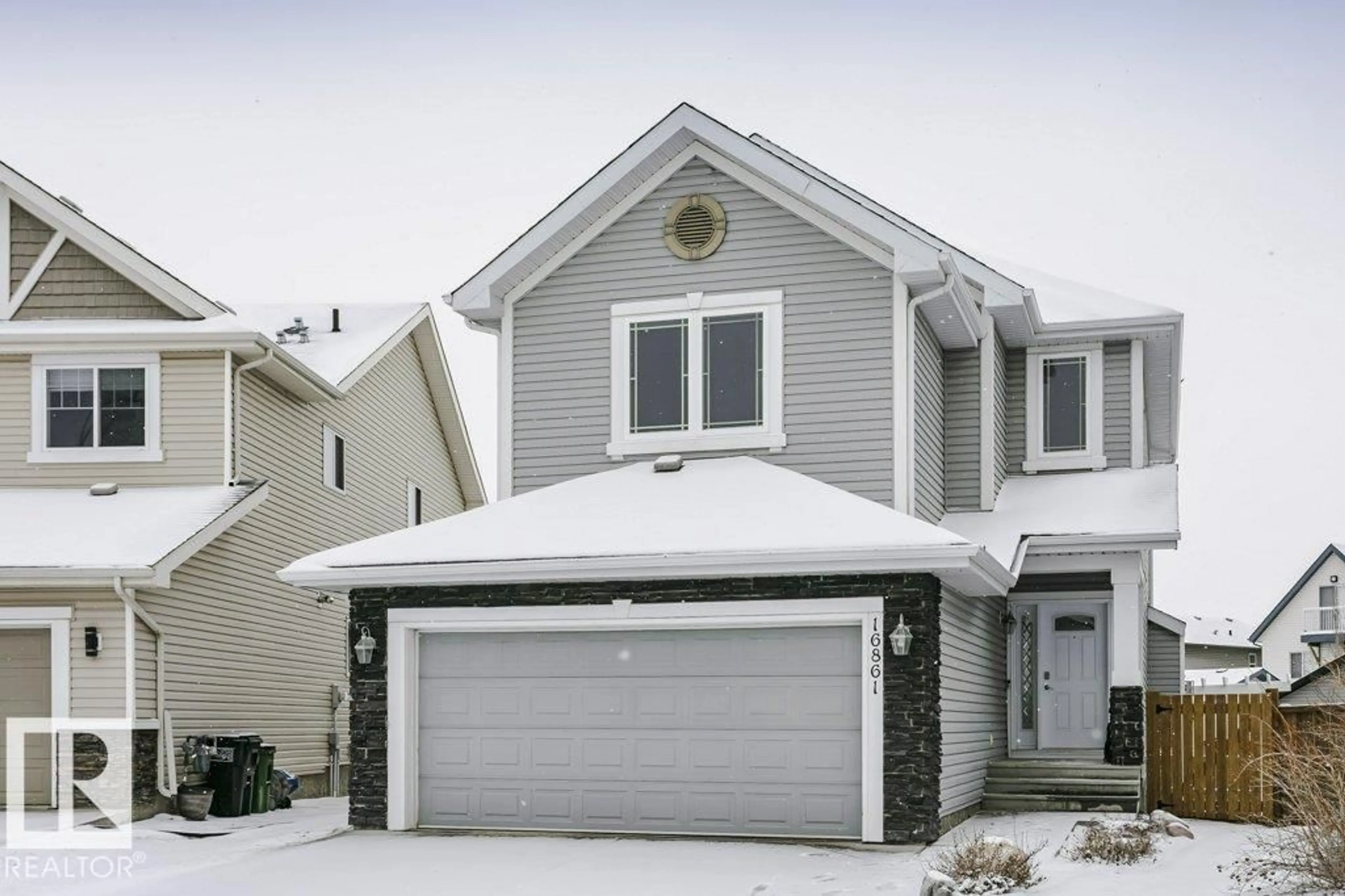 Home with vinyl exterior material, street for 16861 58A ST NW, Edmonton Alberta T5Y0N1