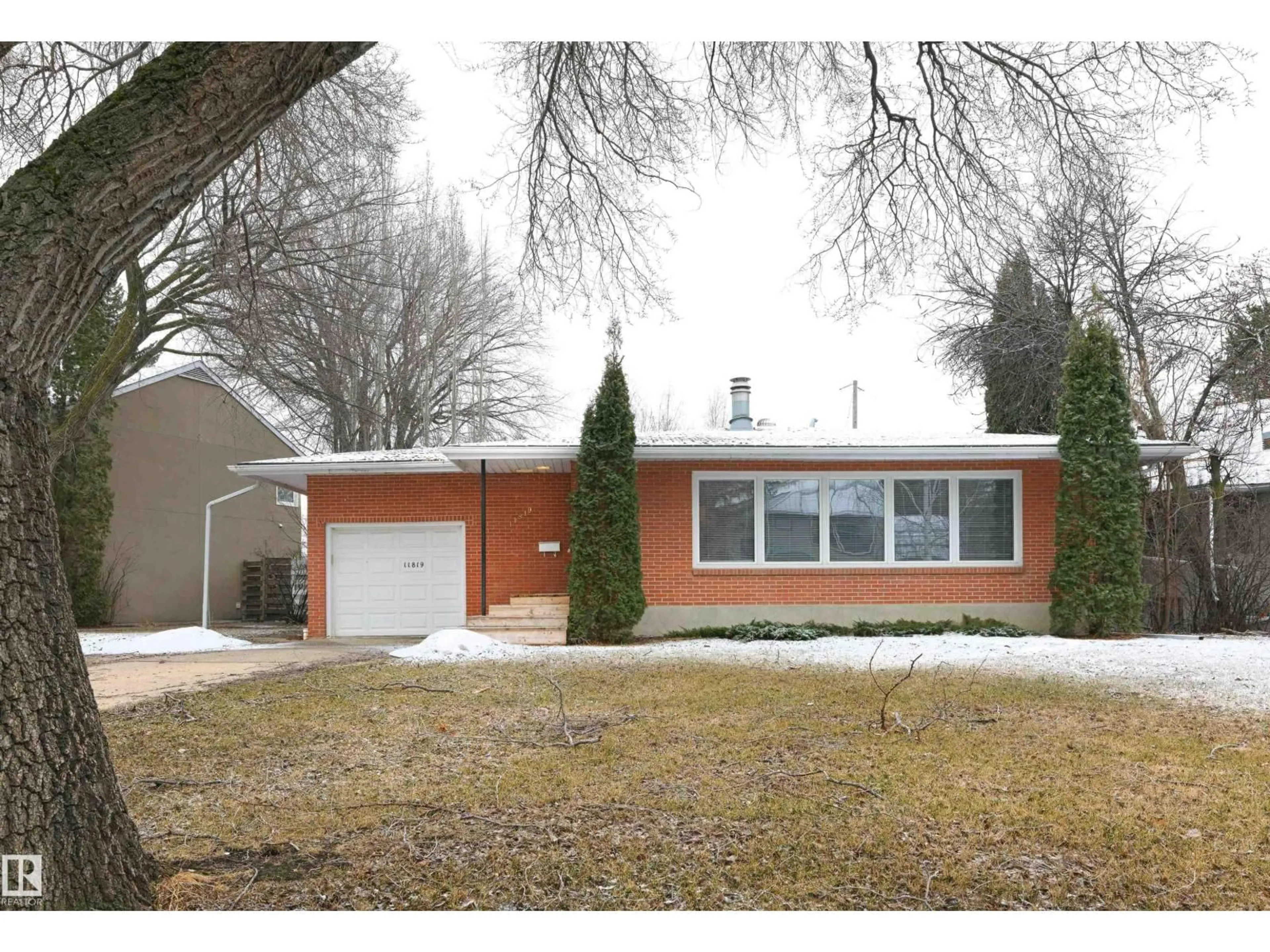 Home with brick exterior material, street for 11819 75 AV, Edmonton Alberta T6G0J4