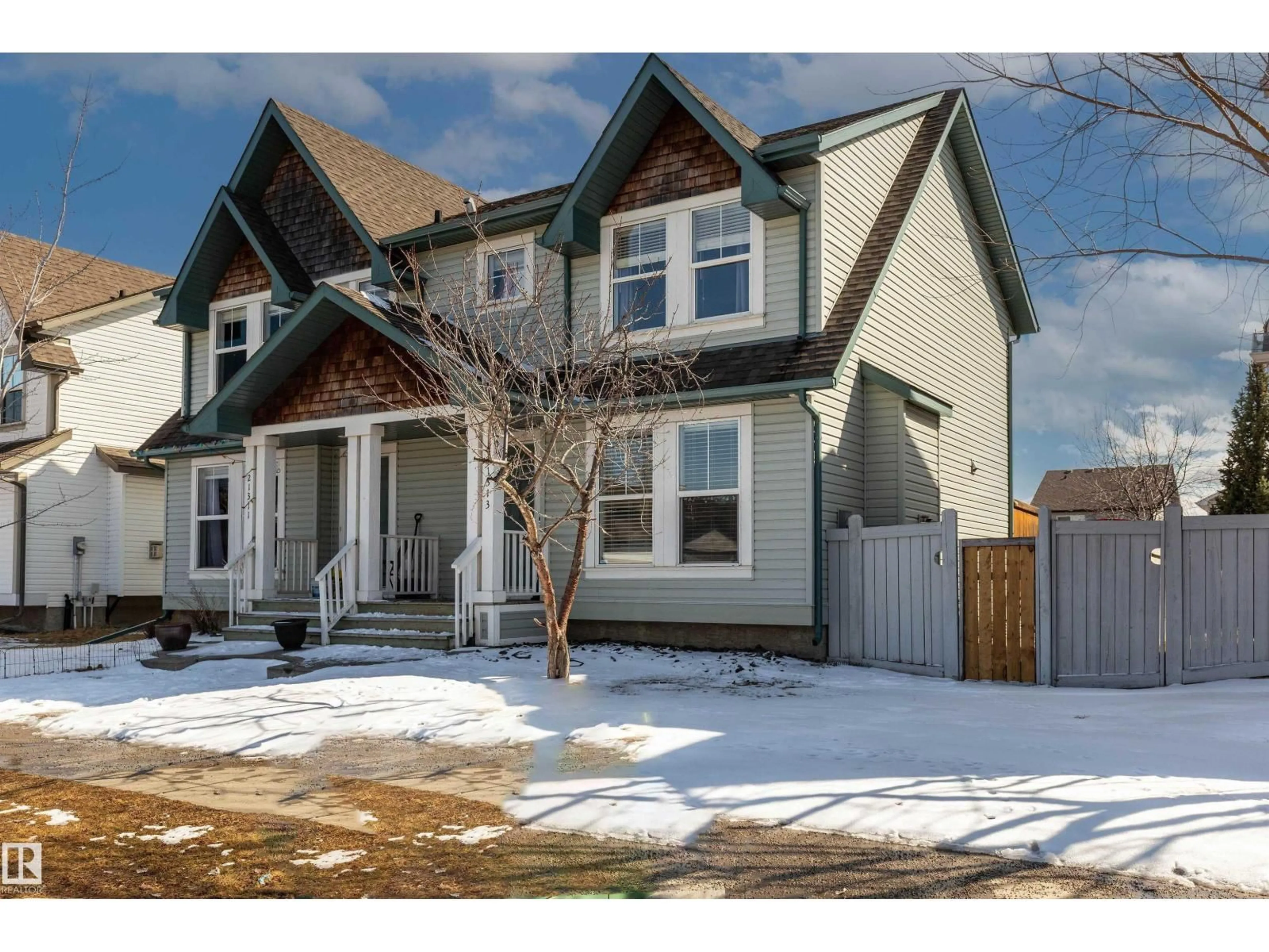 Home with vinyl exterior material, street for 21313 60 AV, Edmonton Alberta T6M0H8