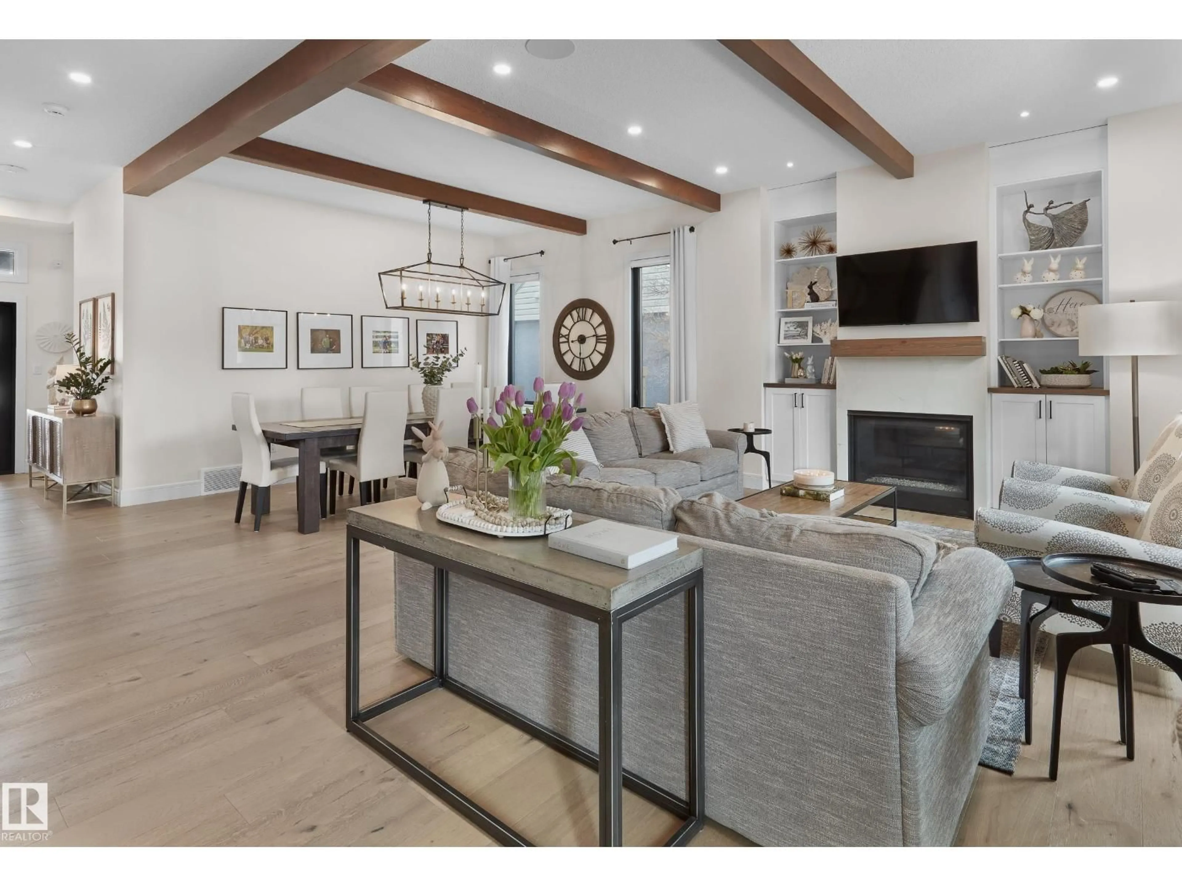 Living room with furniture, wood/laminate floor for NW - 10934 131 ST, Edmonton Alberta T5M1B4