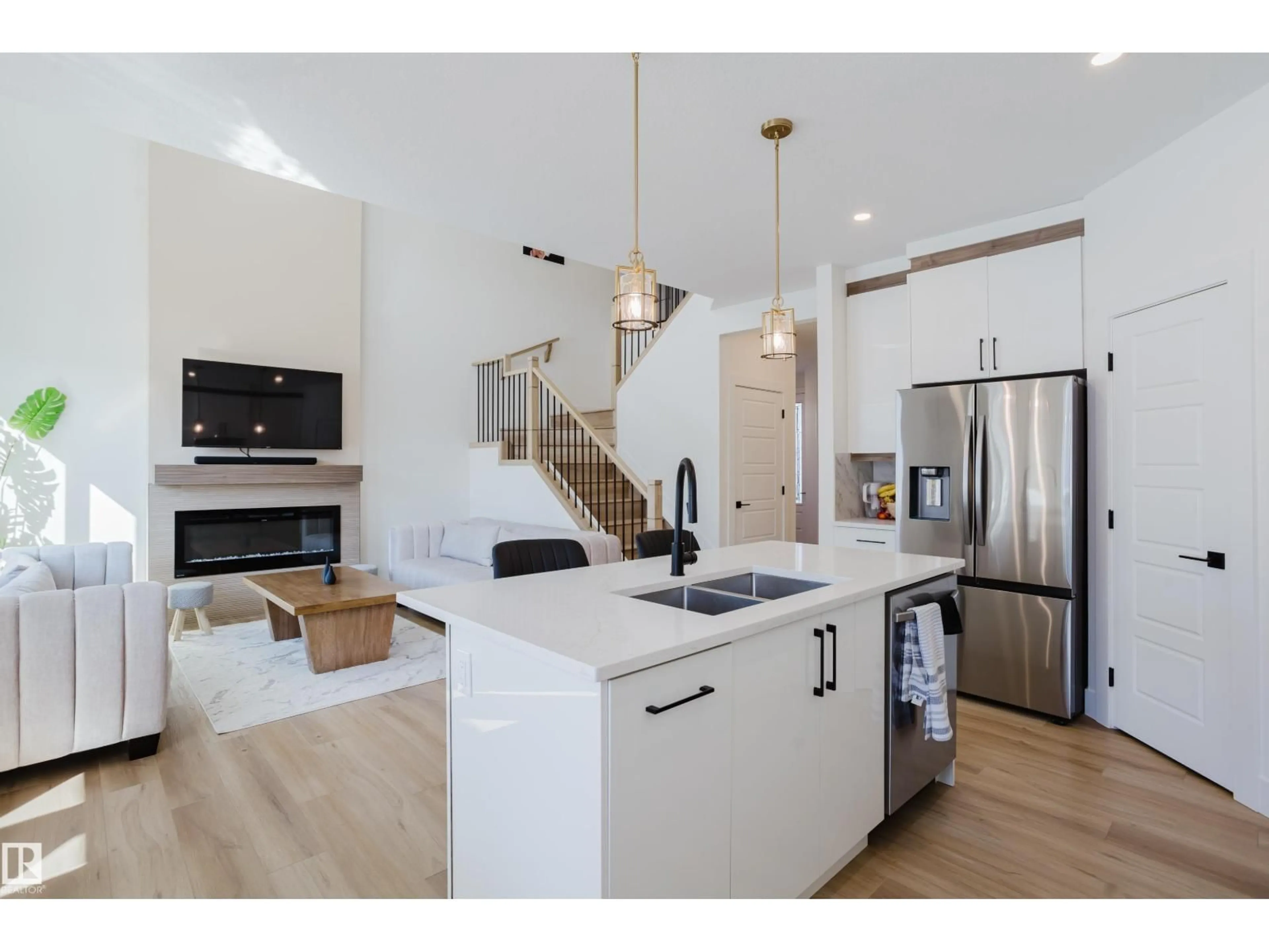 Open concept kitchen, wood/laminate floor for 79 SILVERSTONE DR, Stony Plain Alberta T7Y0E8