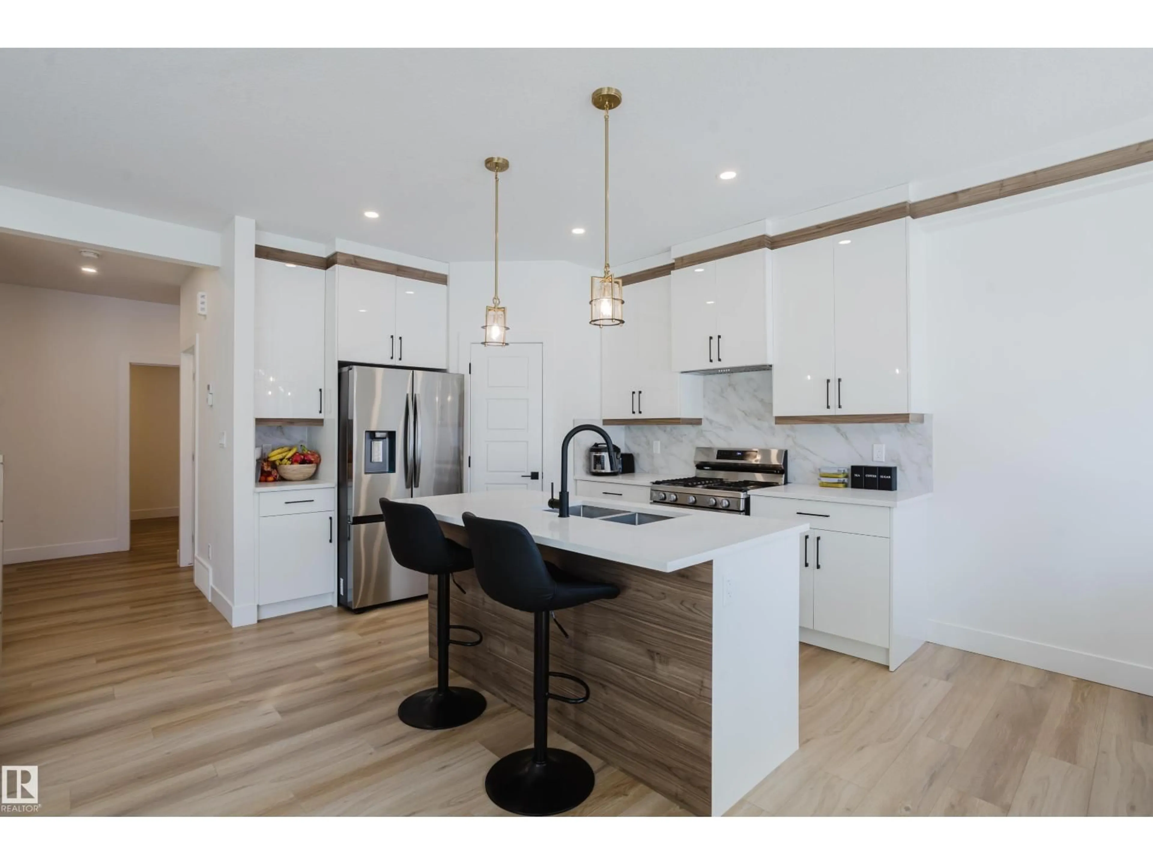 Open concept kitchen, wood/laminate floor for 79 SILVERSTONE DR, Stony Plain Alberta T7Y0E8