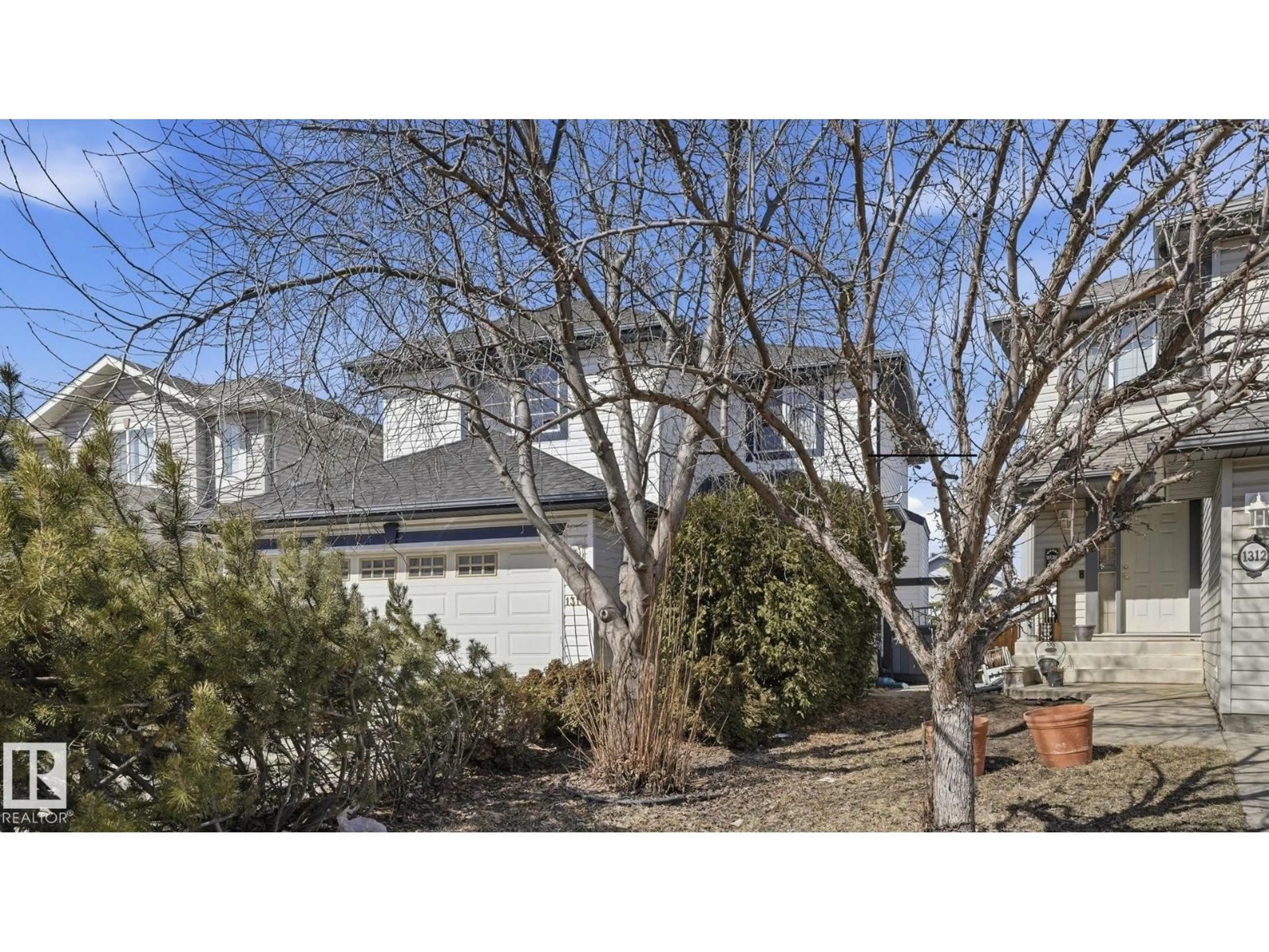 A pic from outside/outdoor area/front of a property/back of a property/a pic from drone, street for 1310 BARNES CL, Edmonton Alberta T6W1E5