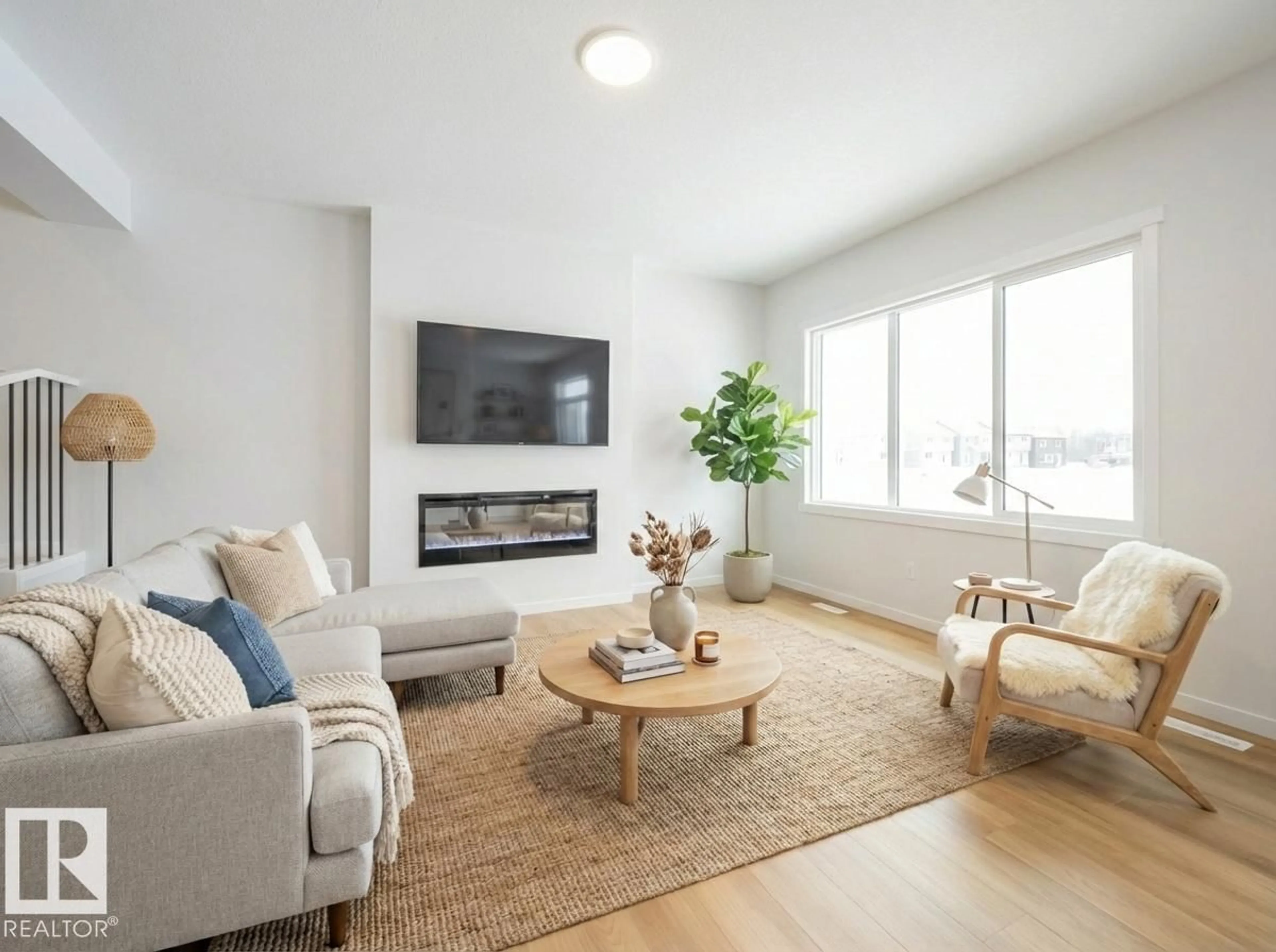 Living room with furniture, wood/laminate floor for 19430 22A AV, Edmonton Alberta T6M3J2