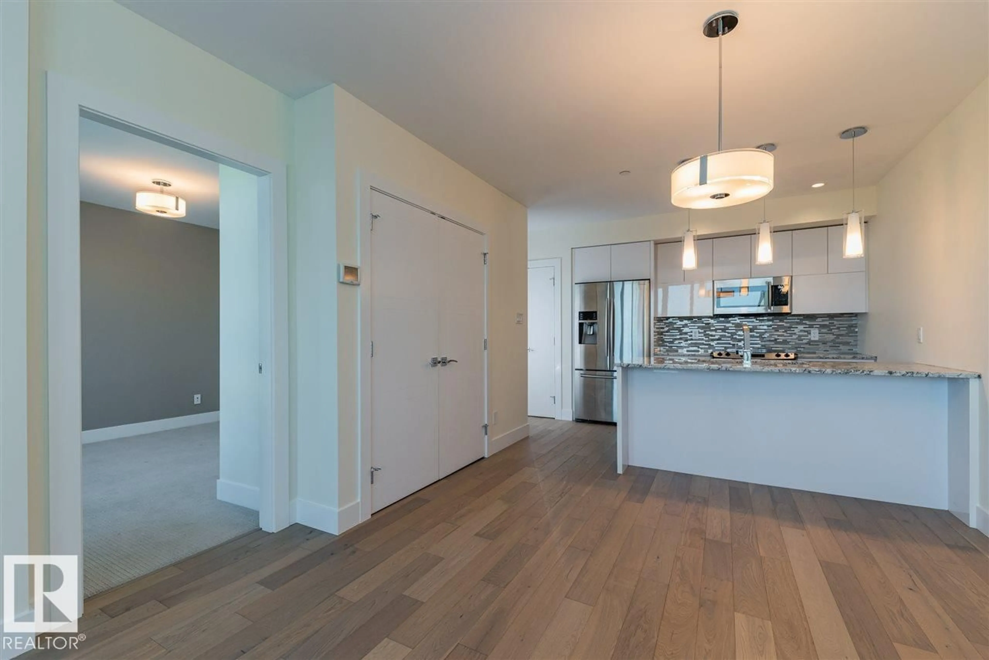 Open concept kitchen, wood/laminate floor for #401 - 11969 JASPER AV, Edmonton Alberta T5K0P1