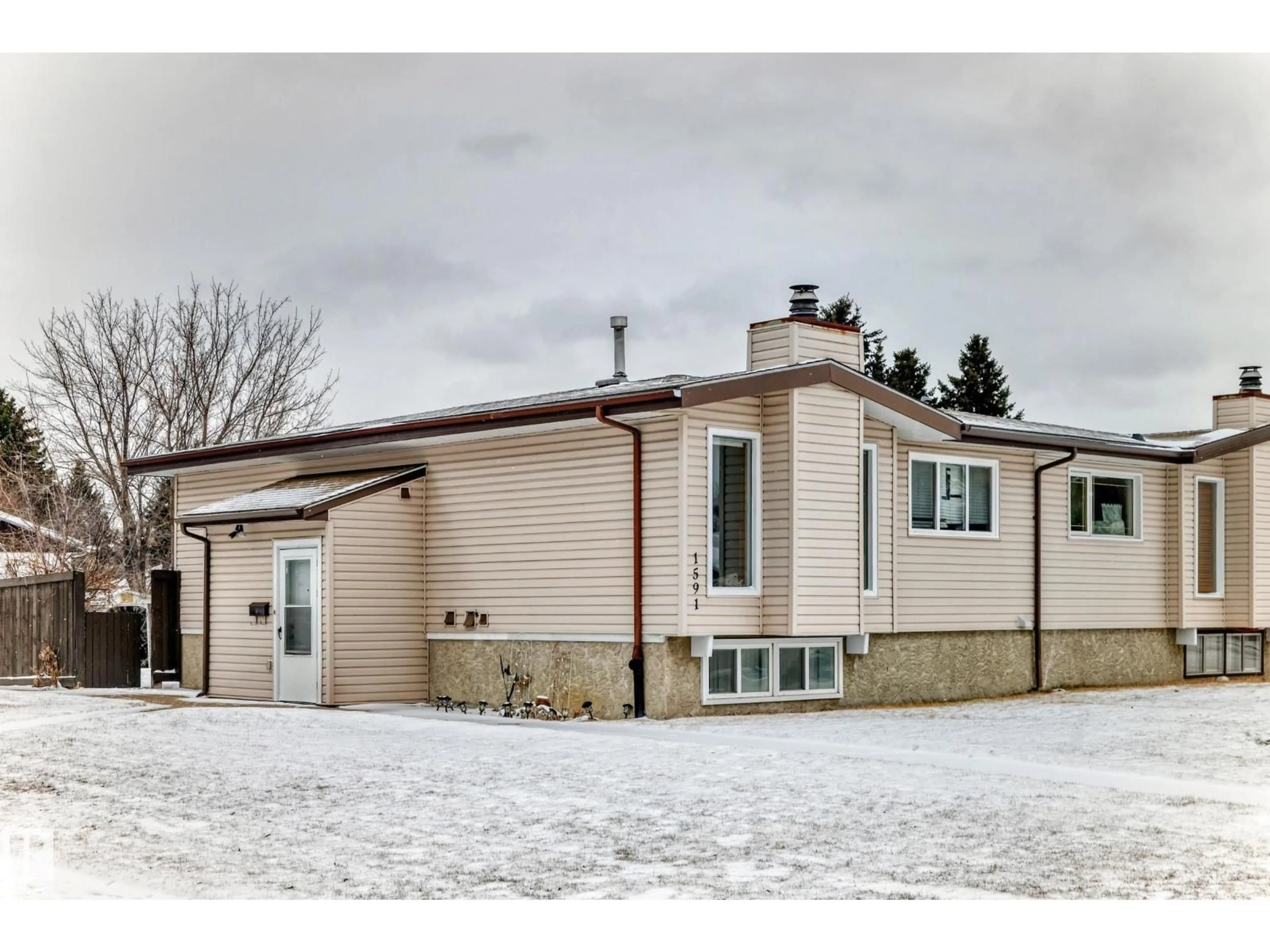 Home with vinyl exterior material, street for 1591 KNOTTWOOD RD, Edmonton Alberta T6K2N3