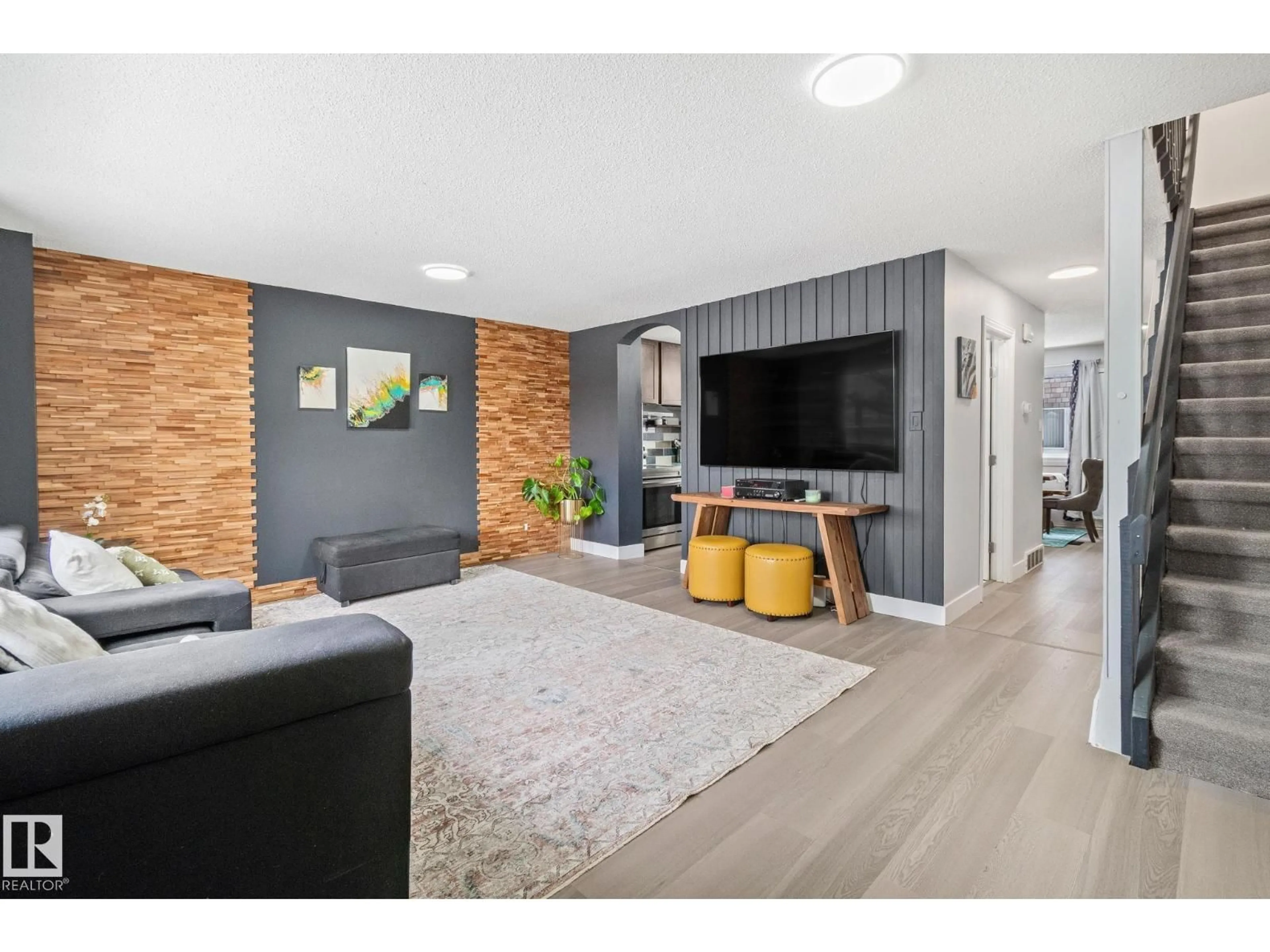 Living room with furniture, wood/laminate floor for 209 VILLAGE ON THE GREEN GR, Edmonton Alberta T5A1H2