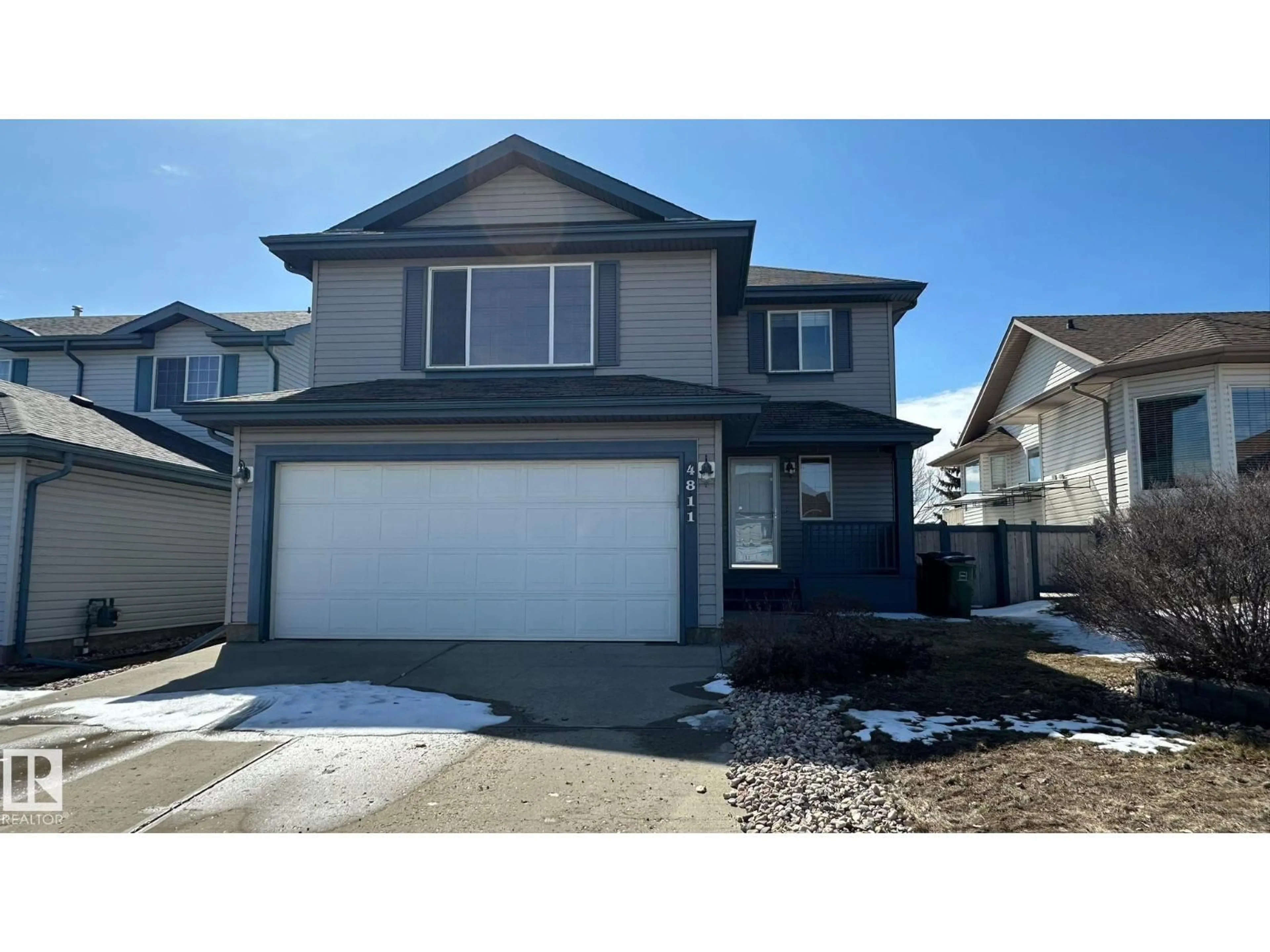 Home with vinyl exterior material, street for NW - 4811 152 AV, Edmonton Alberta T5Y3B8