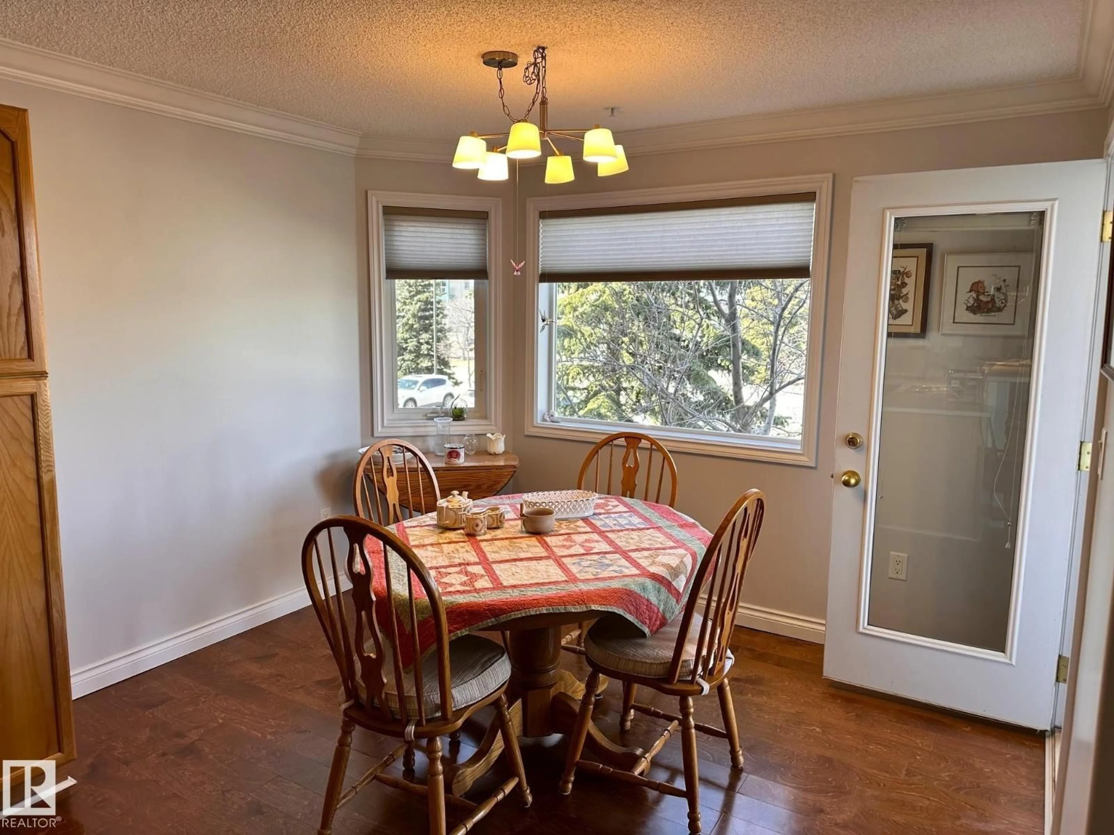 Dining room, wood/laminate floor for 69 - 202 CRYSTAL LN, Sherwood Park Alberta T7H2E9